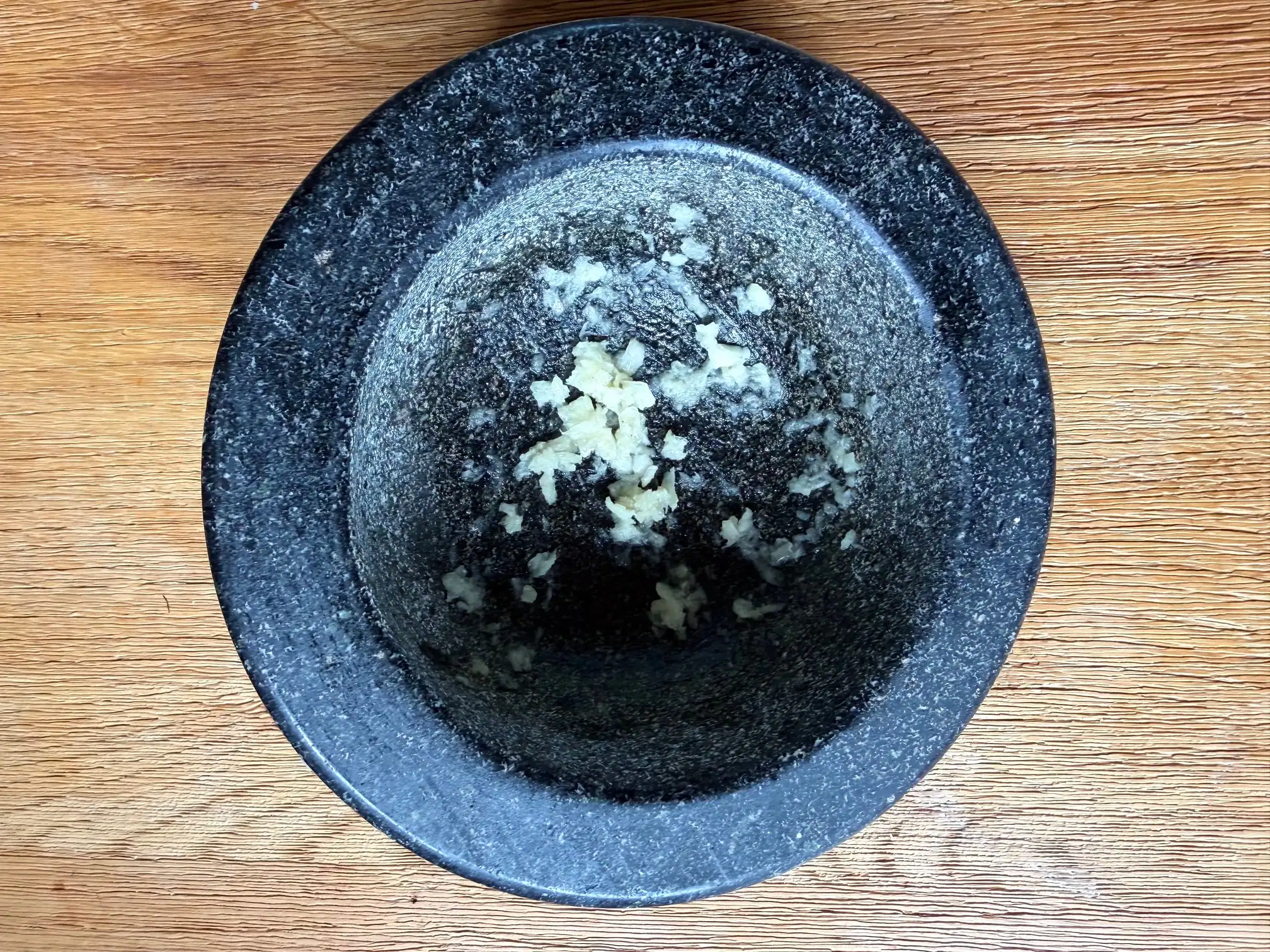 crushed garlic in pestle and mortar