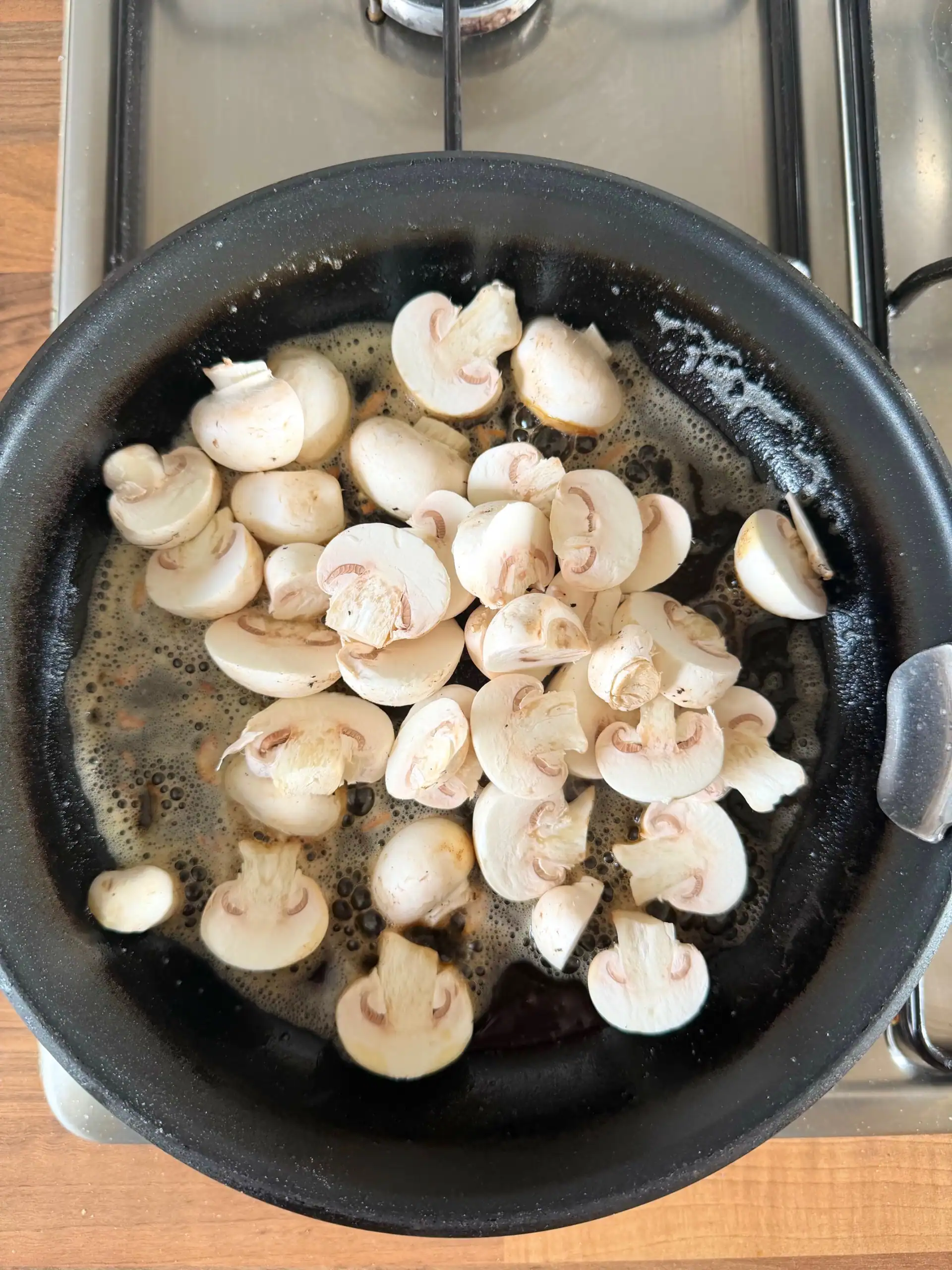 mushrooms cooking in a pan