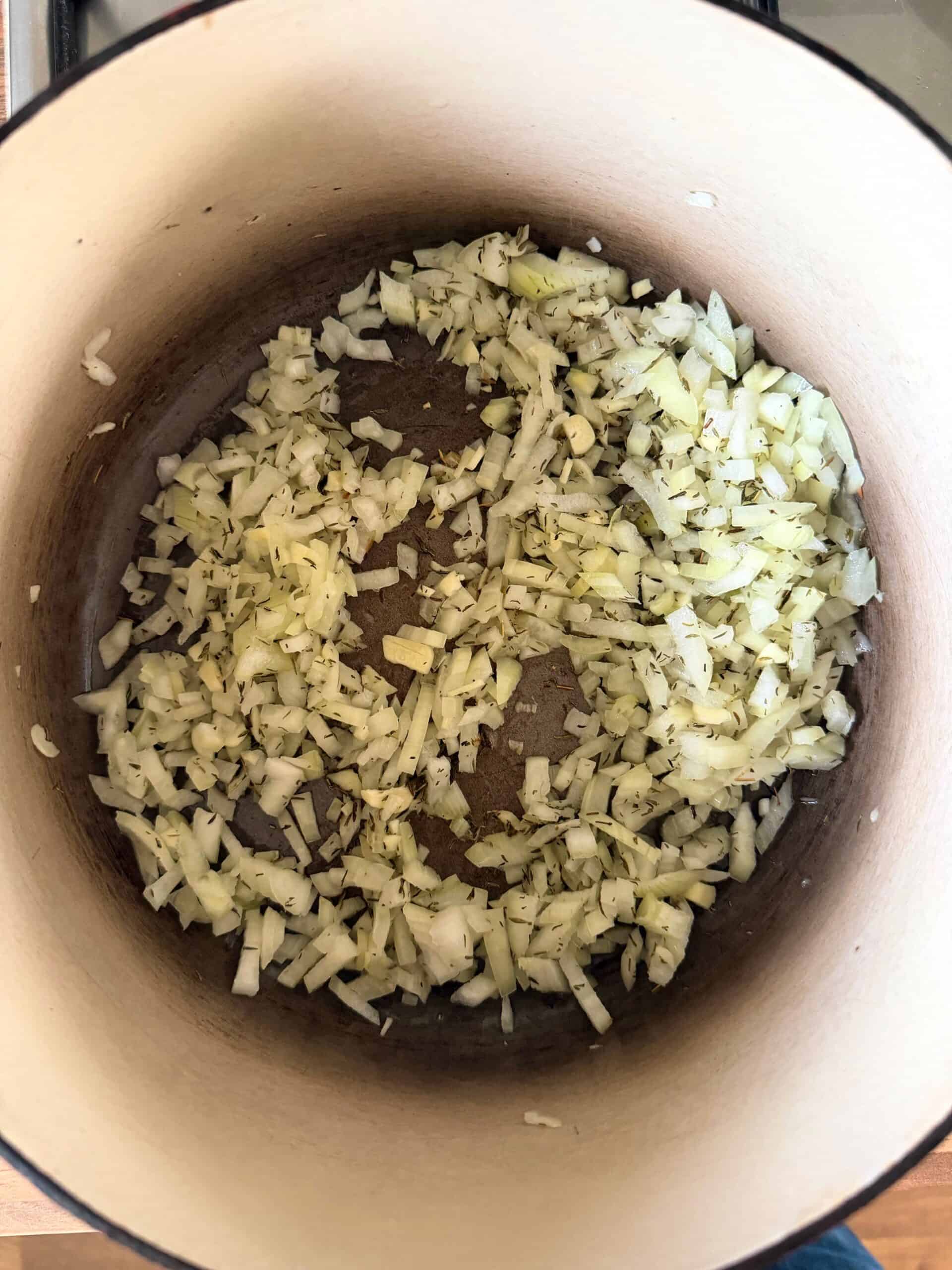 cooking onions and garlic in a pan