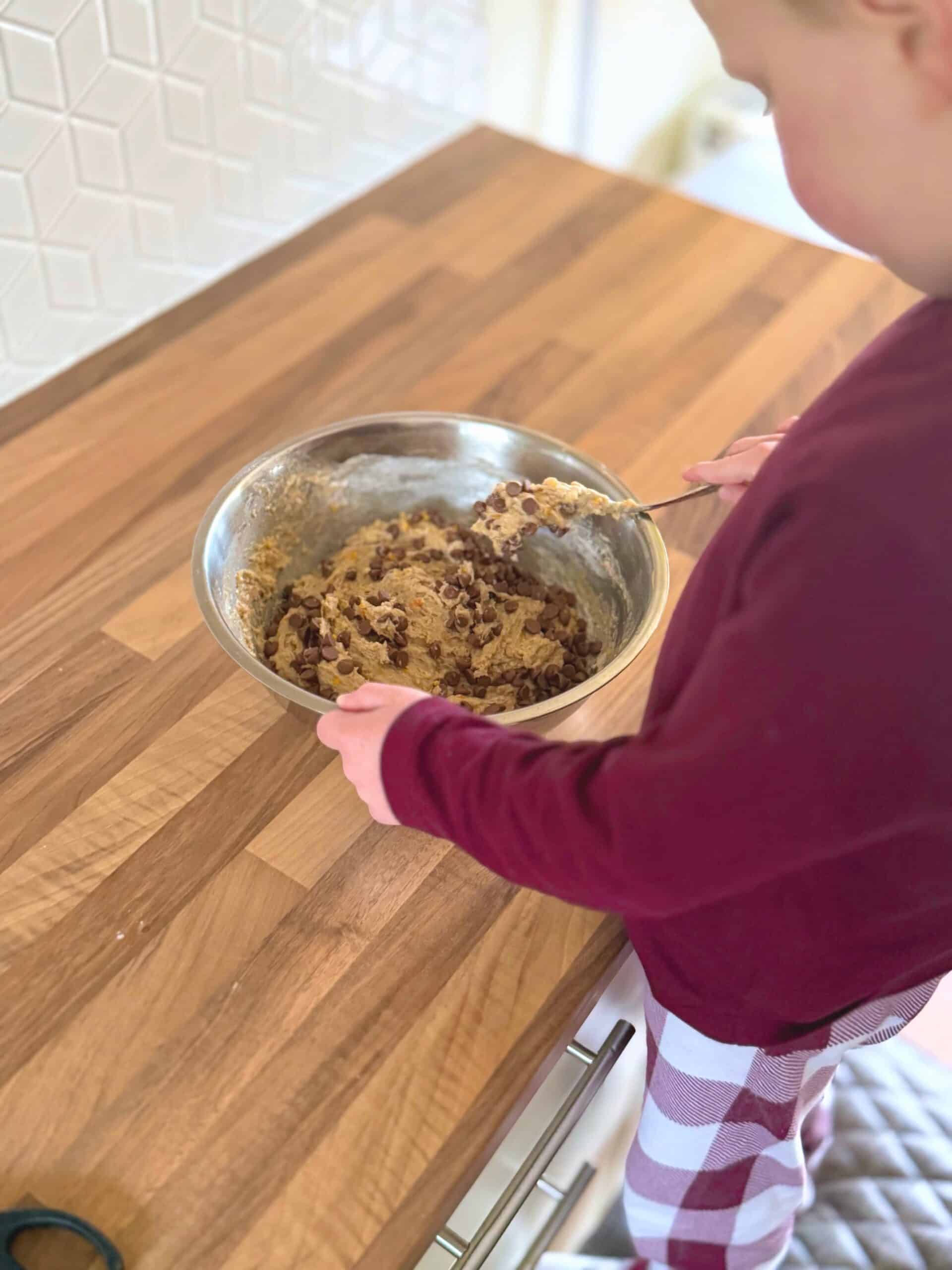 5 year old mixing the dough
