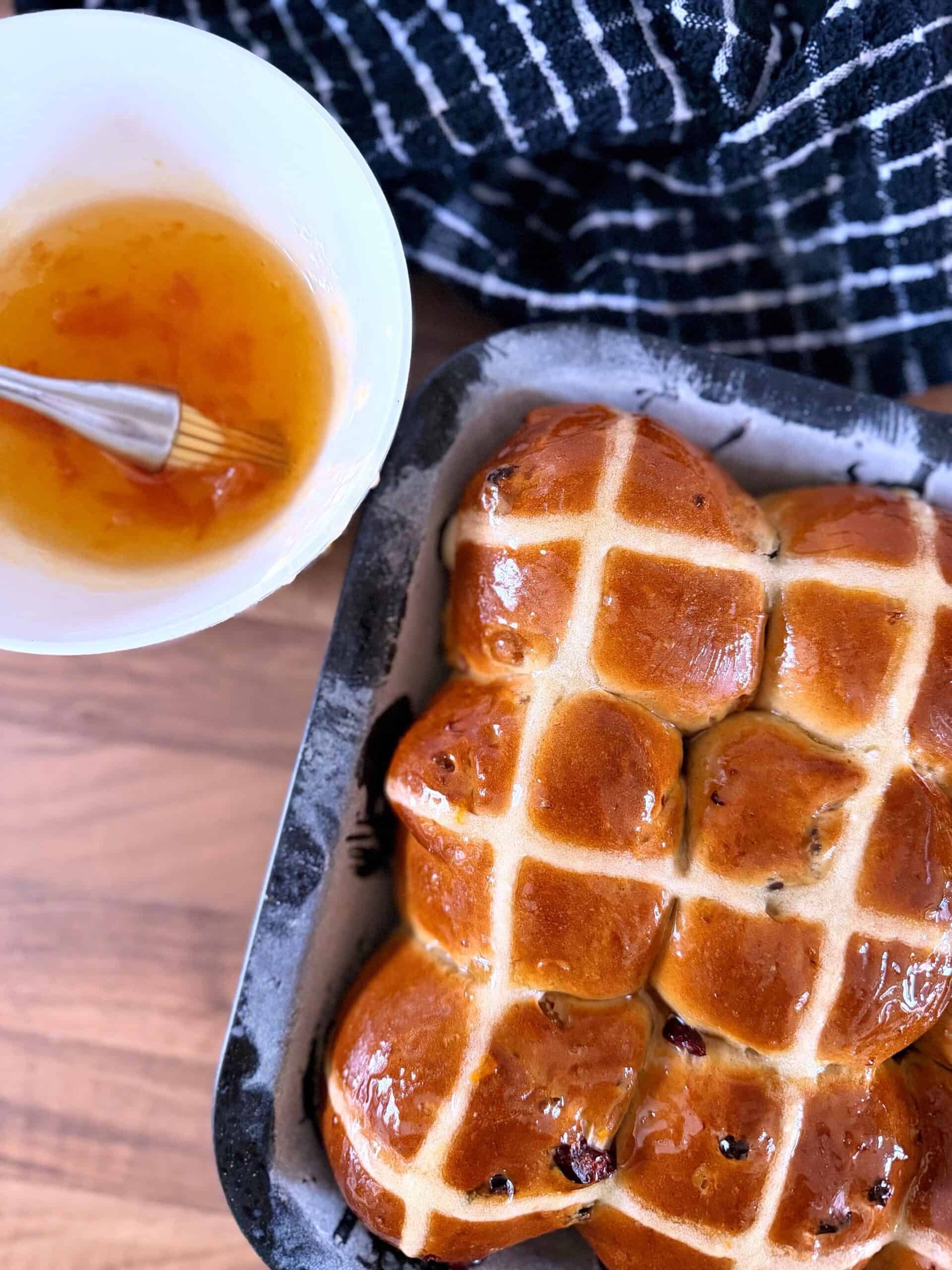 glazing hot cross buns with apricot jam