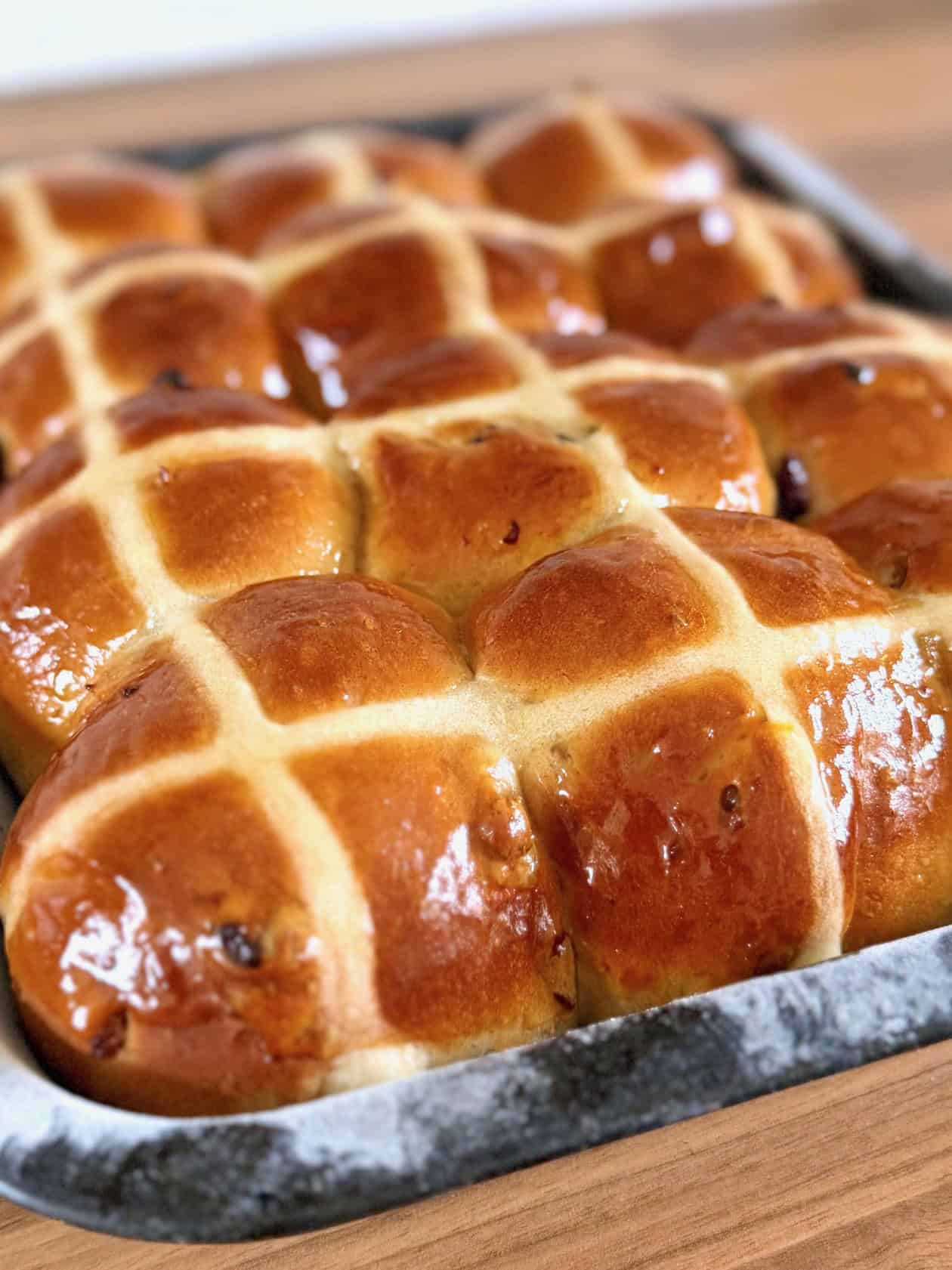 tray of glazed hot cross buns