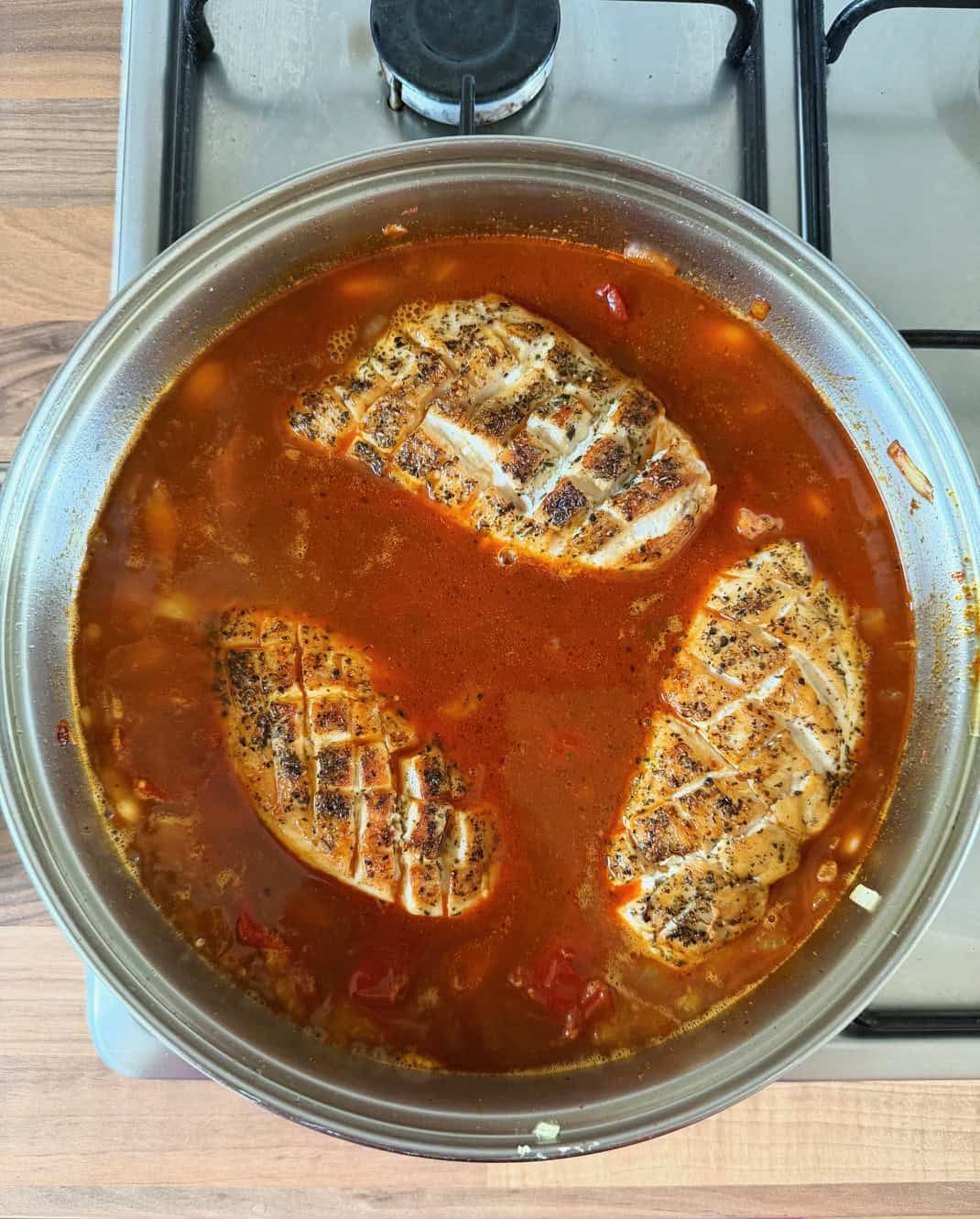 stock and chicken in pan