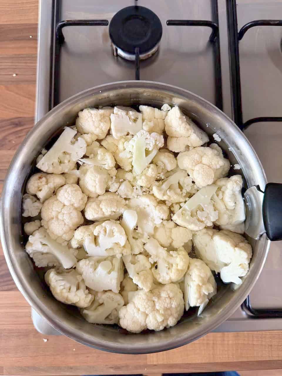 cauliflower in a  pan of water
