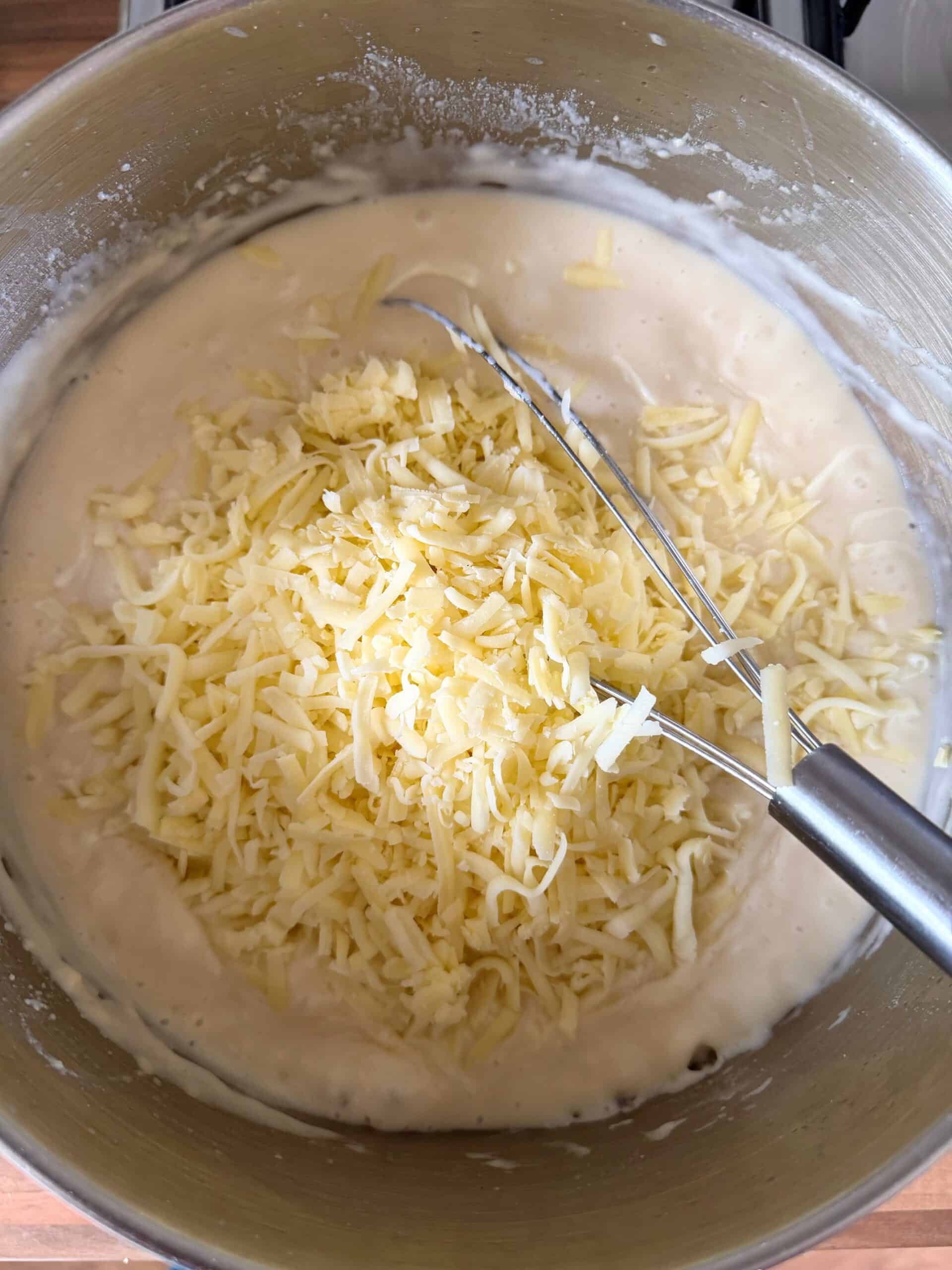 add cheese to the white sauce