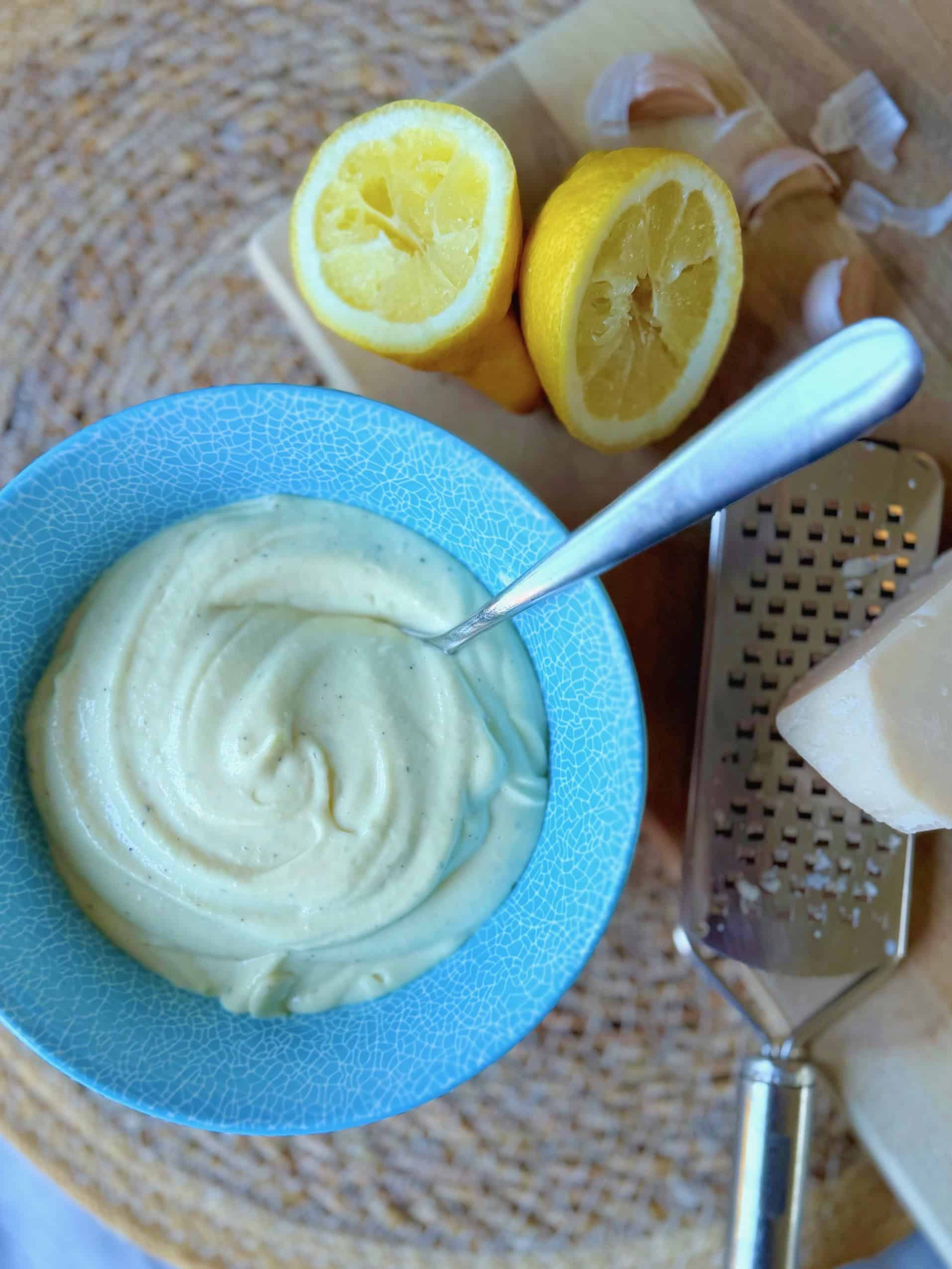 caesar salad dressing in a blue bowl