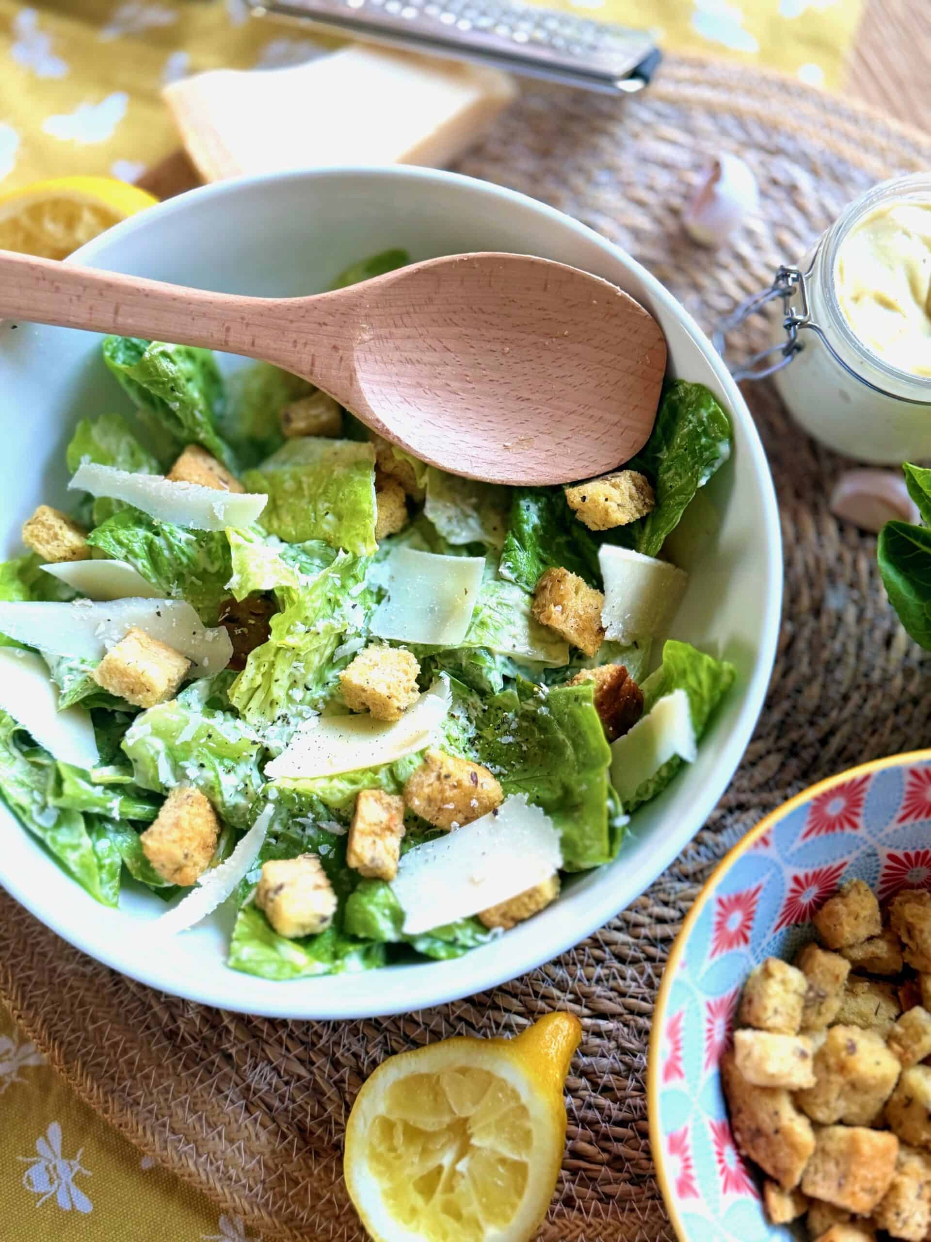 caesar salad with a serving spoon