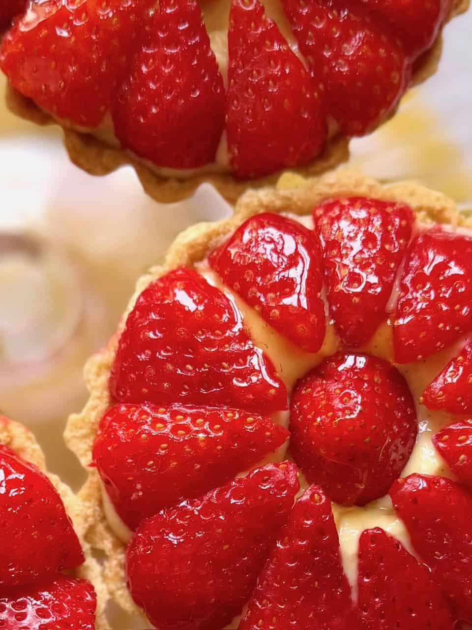 close up of glazed strawberry tart