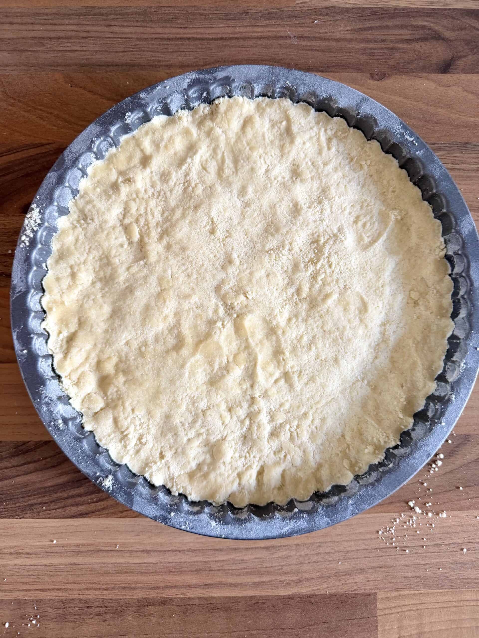press shortbread dough into tins