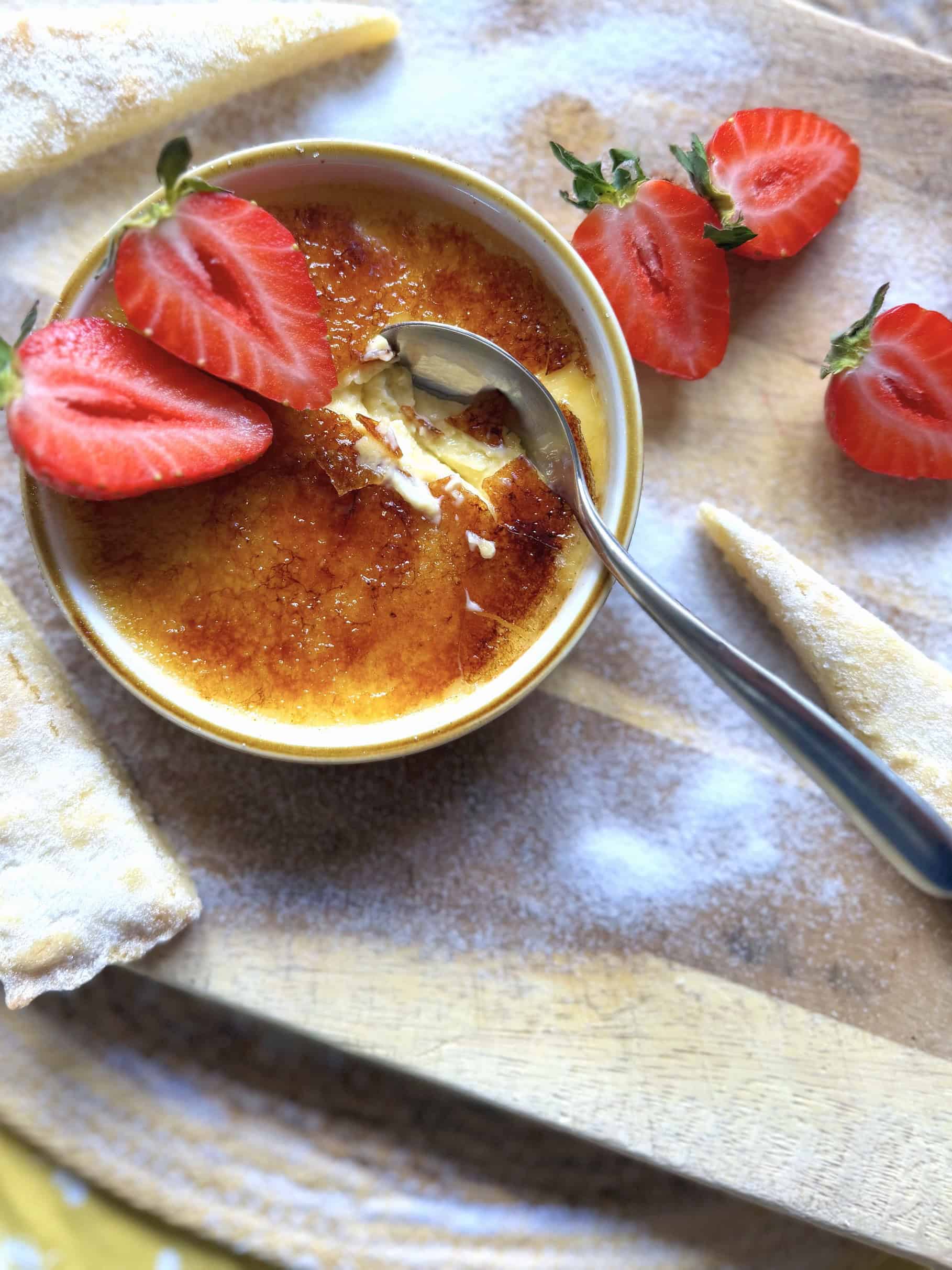 Creme brulee with shortbread and strawberries