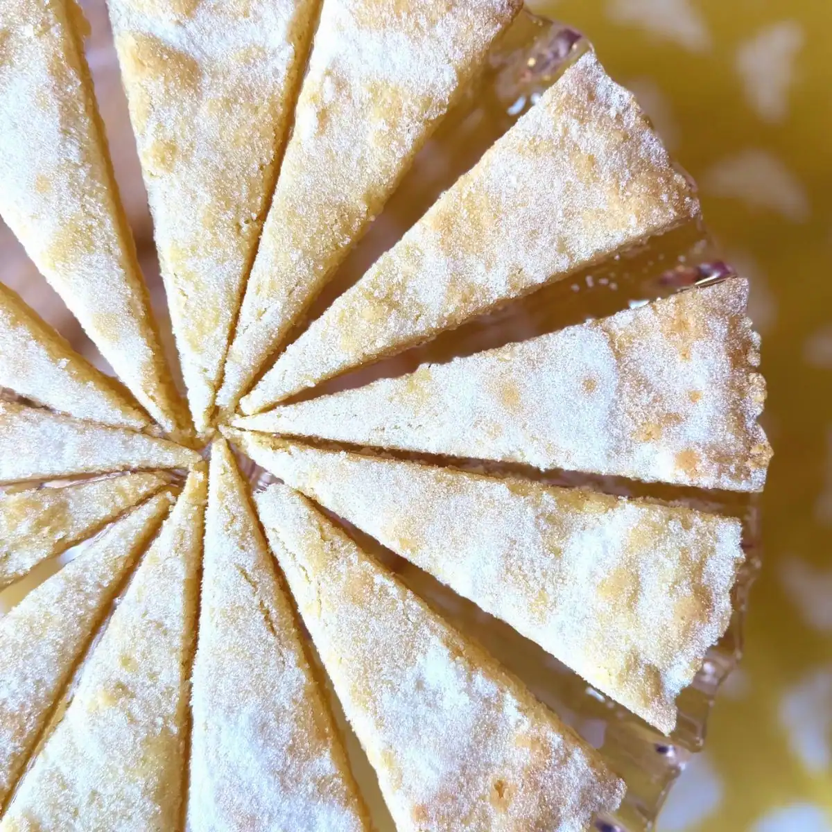 Shortbread triangles on a cake tray