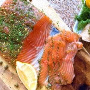 salmon gravlax with lemon wedge