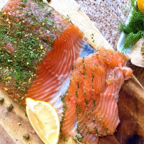 salmon gravlax with lemon wedge