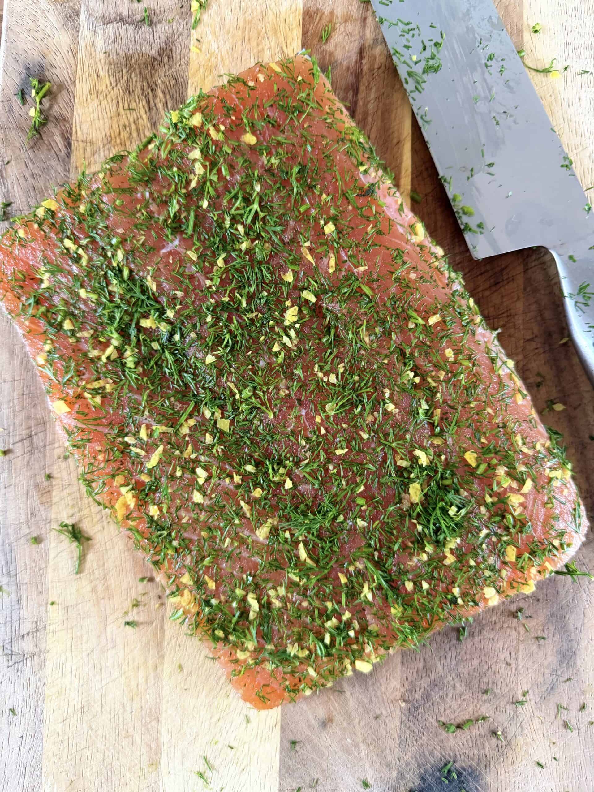 add dill and lemon zest to the salmon