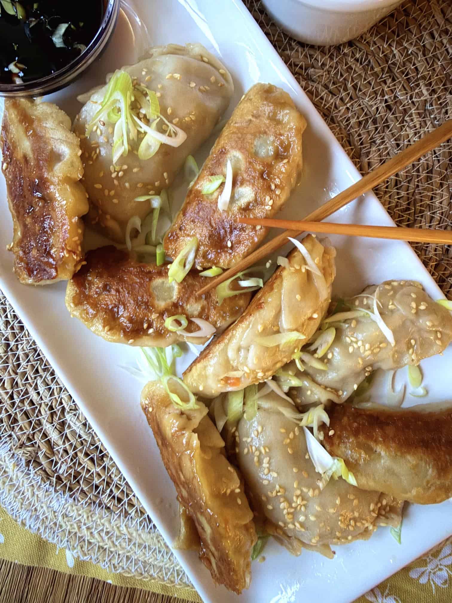 Crispy pork asian potsticker dumplings with cho sticks and dipping sauce