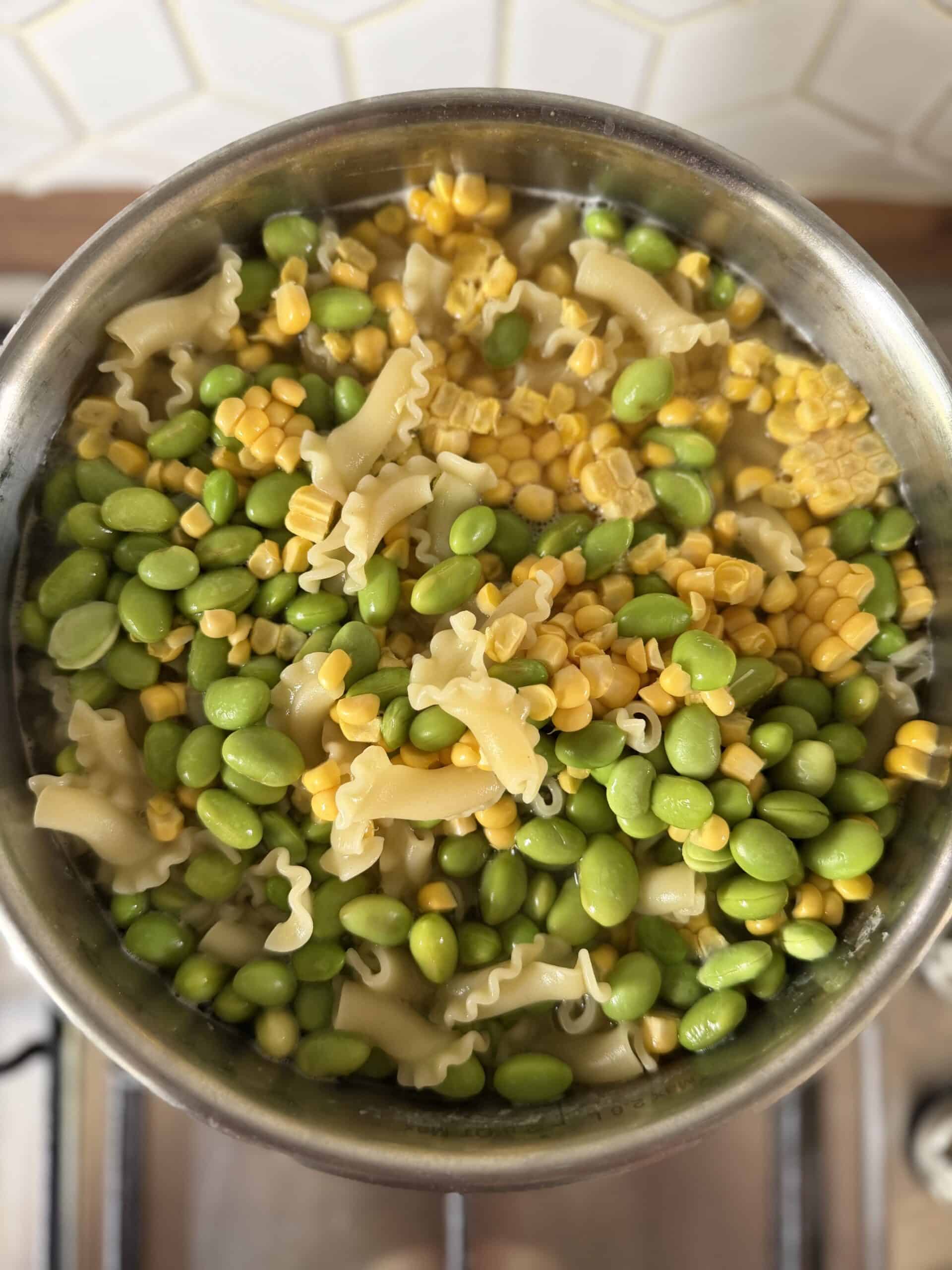 Add beans and sweetcorn to pasta