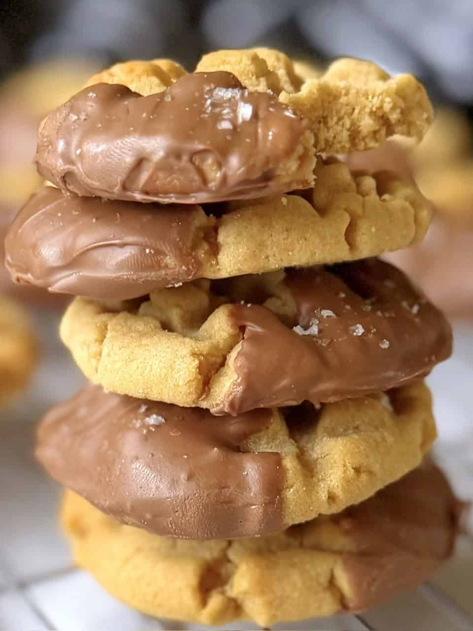 chocolate dipped peanut butter cookies stacked up