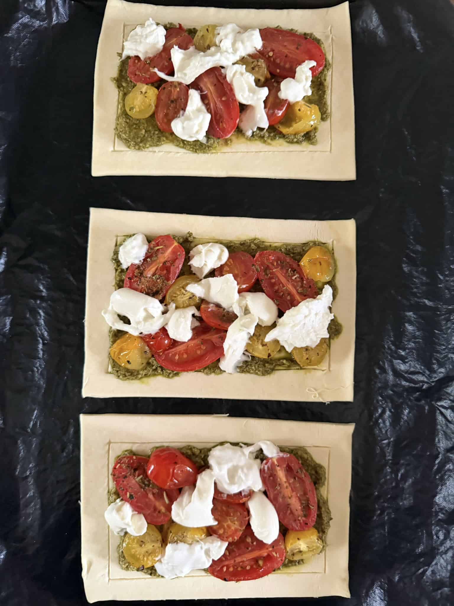 Unbaked tomato, pesto and burrata tarts