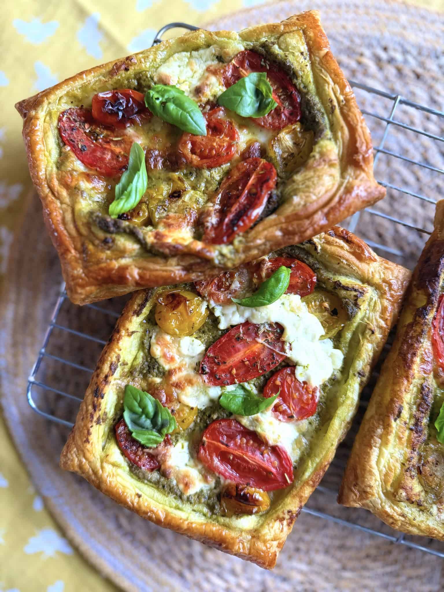 Tomato, pesto and burrata tart with fresh green basil