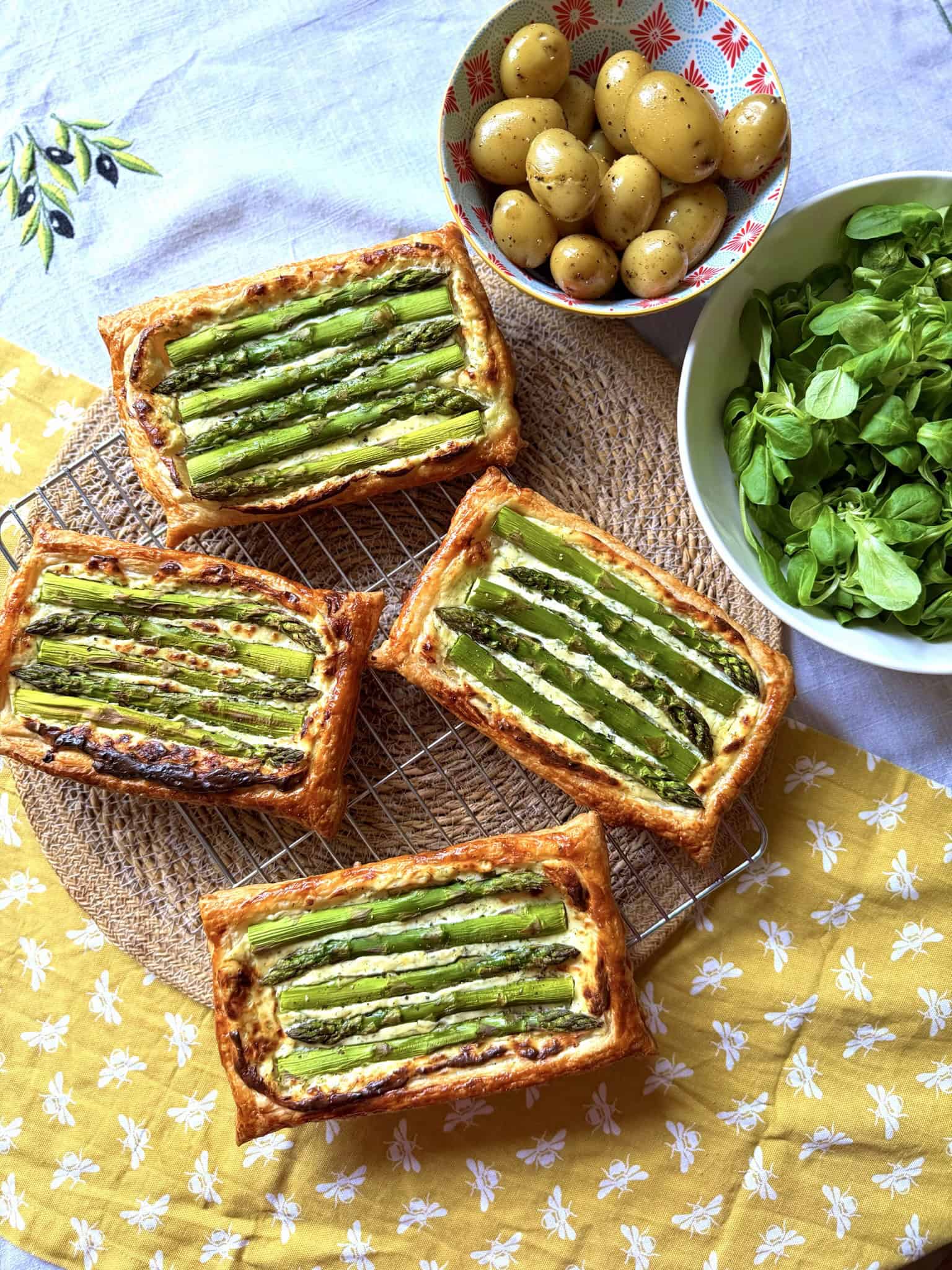 asparagus tart with new potatoes and salad leaves