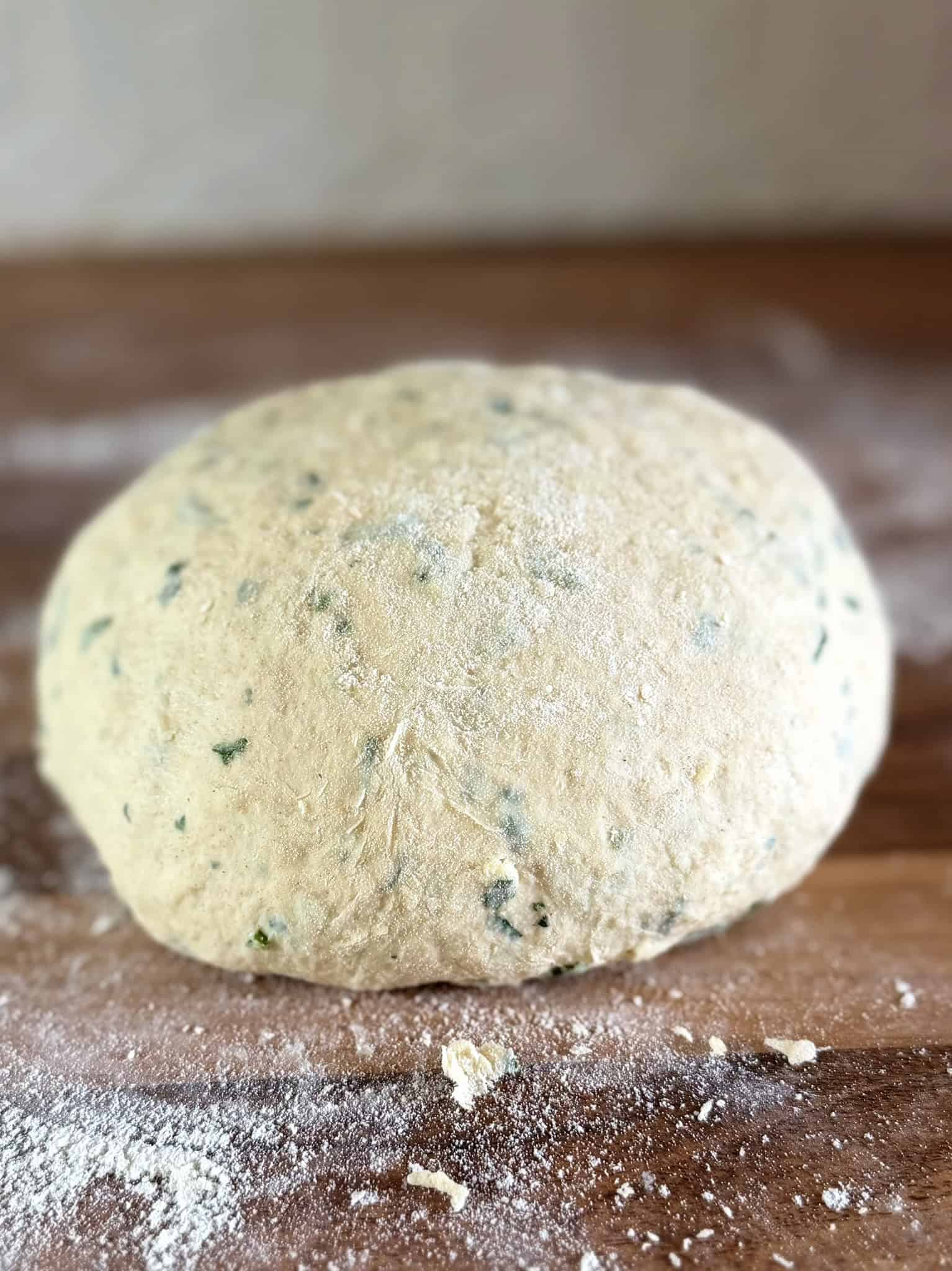 Flatbread dough on a floured surface