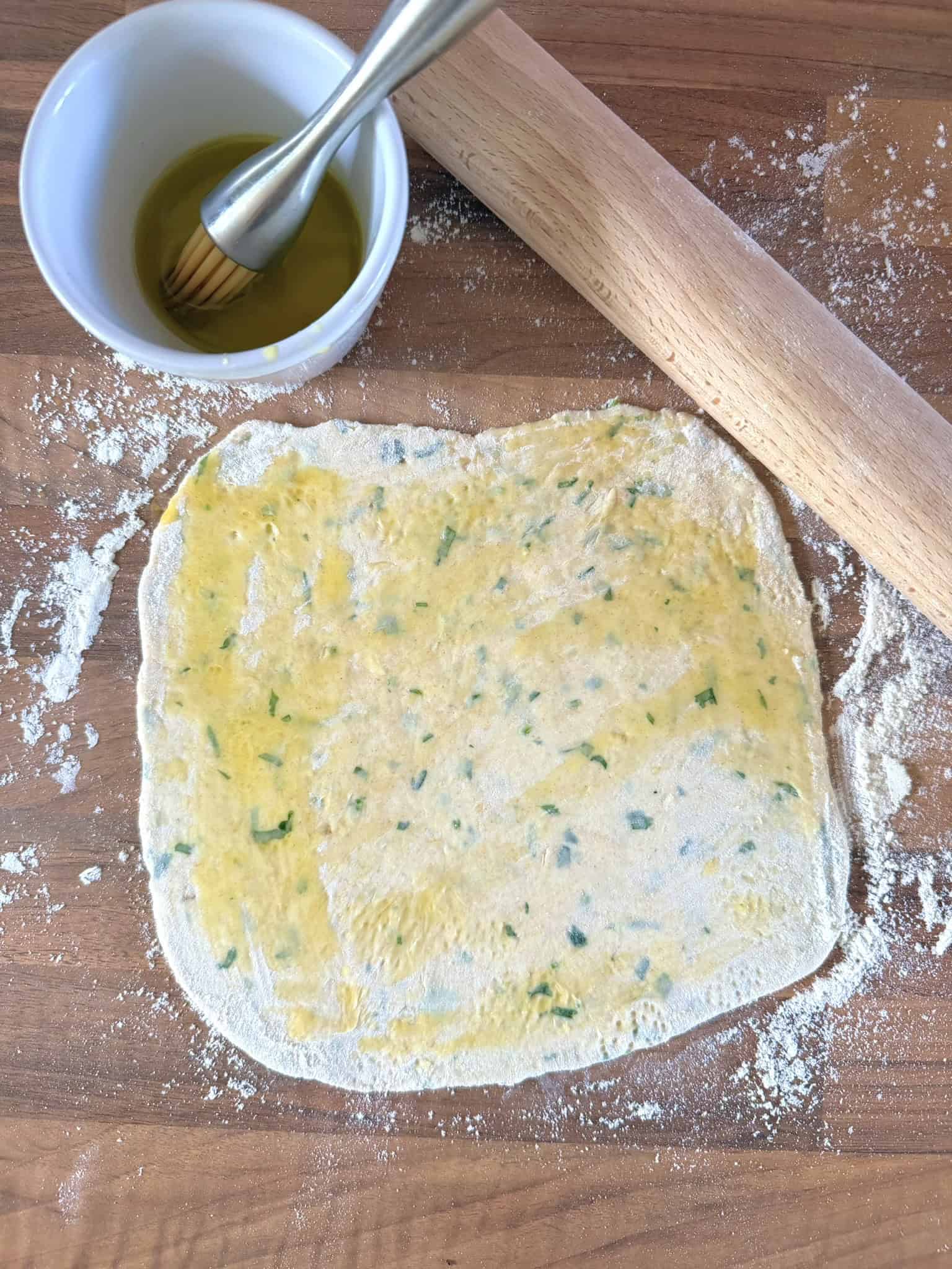 roll the dough out and brush with oil