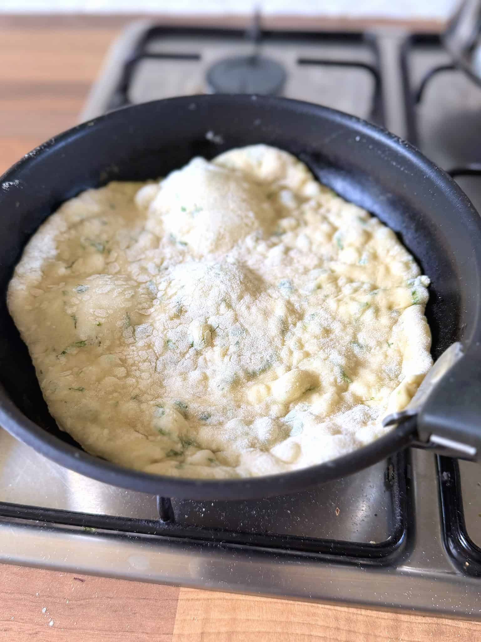 flatbread bubbling up in frying pan