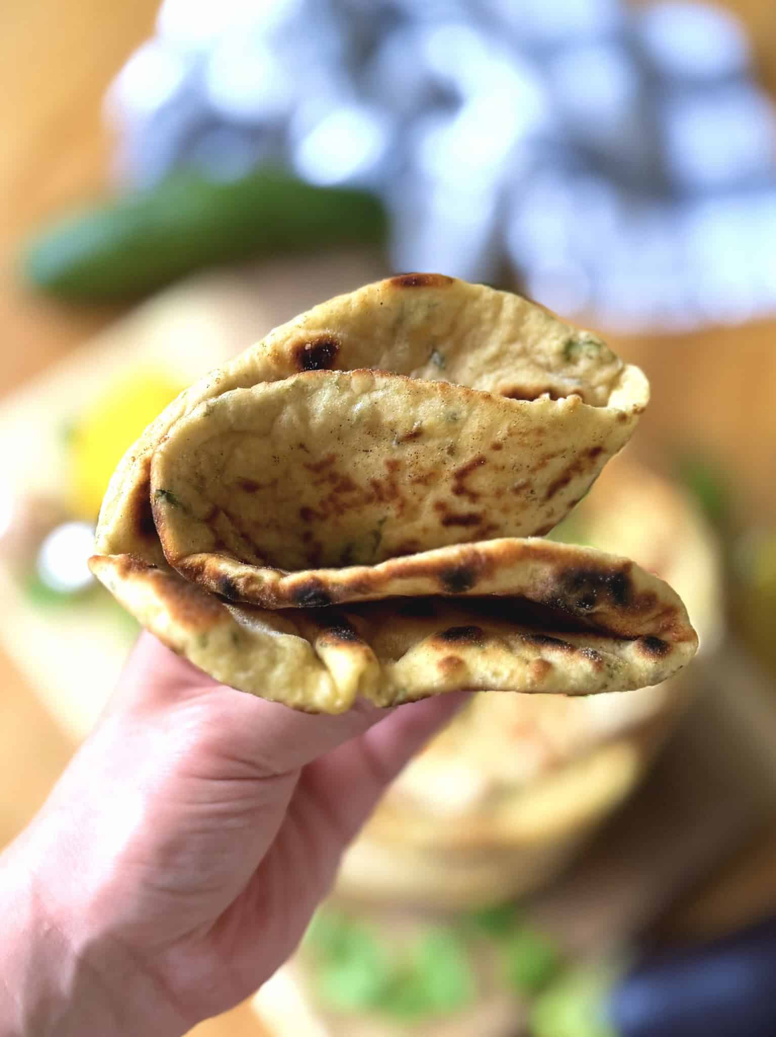 folded flatbread in a hand