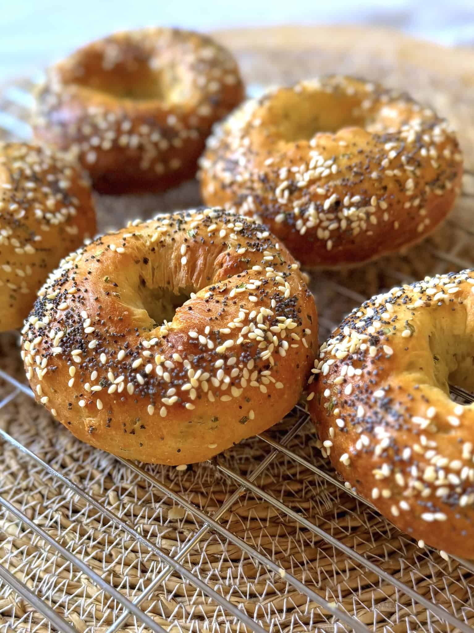 cottage cheese bagels on a cooling rack at an angle
