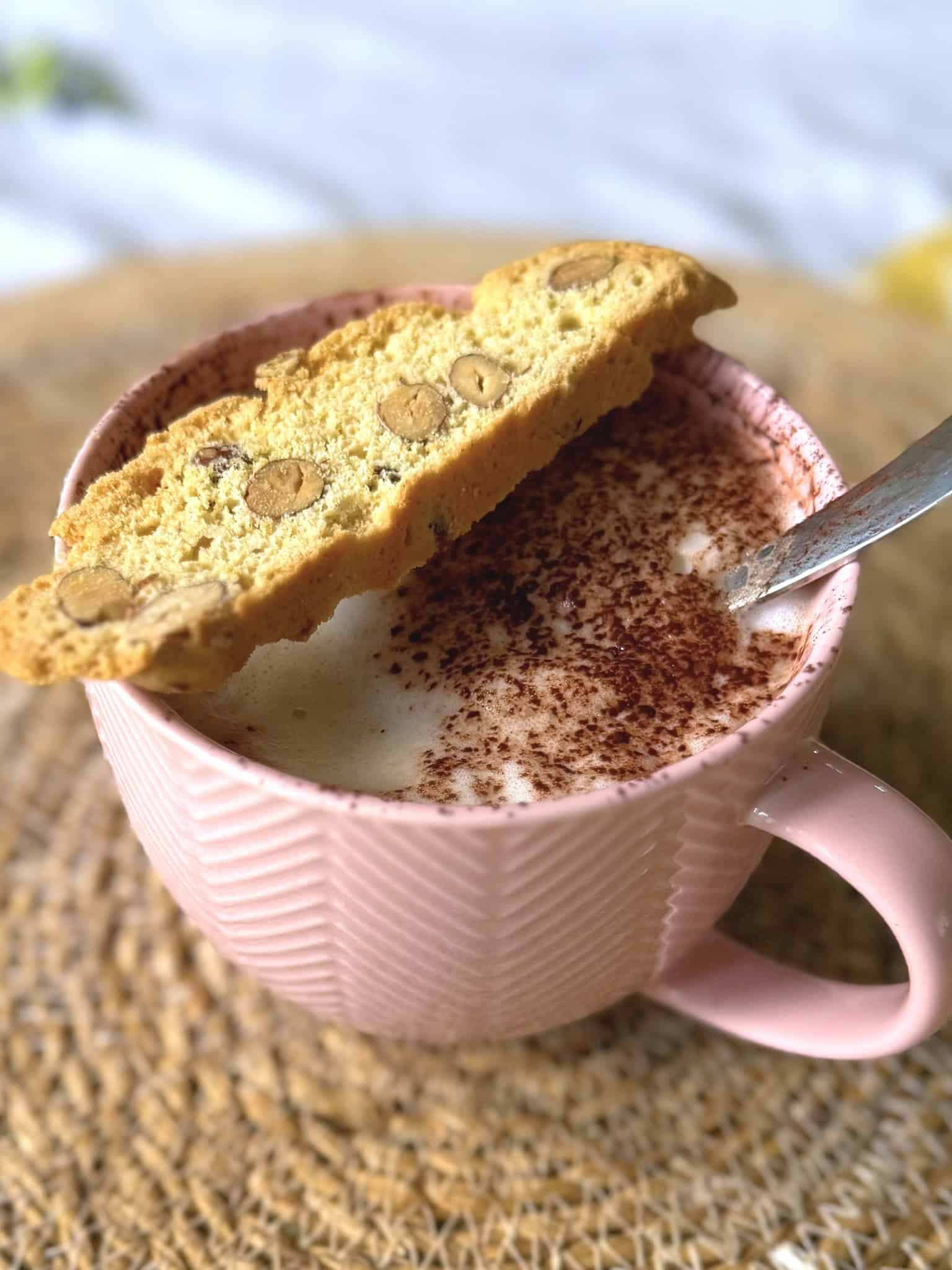 biscotti biscuit on a cup of coffee