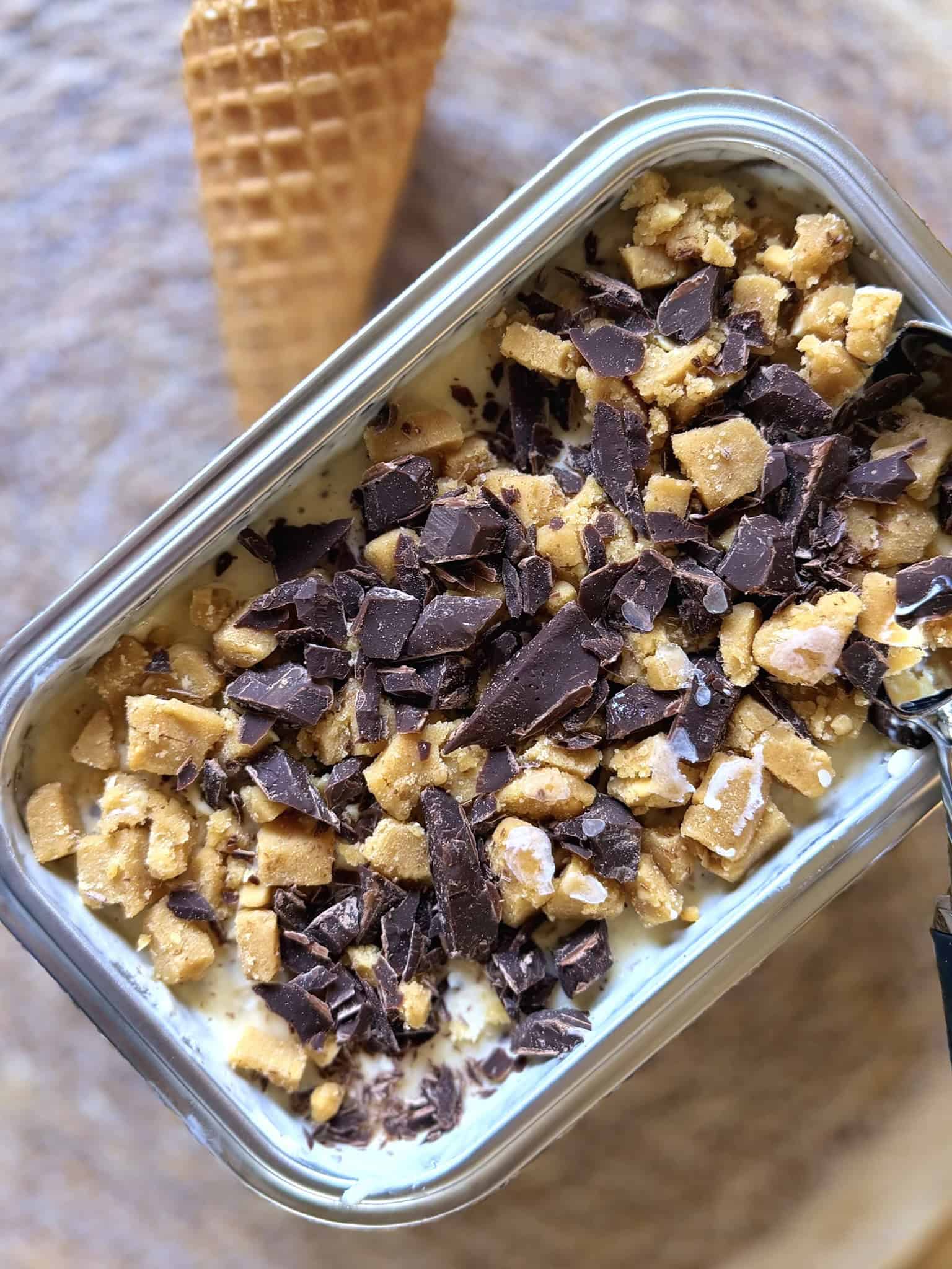 ice cream topped with peanut butter cookie dough and chocolate chips
