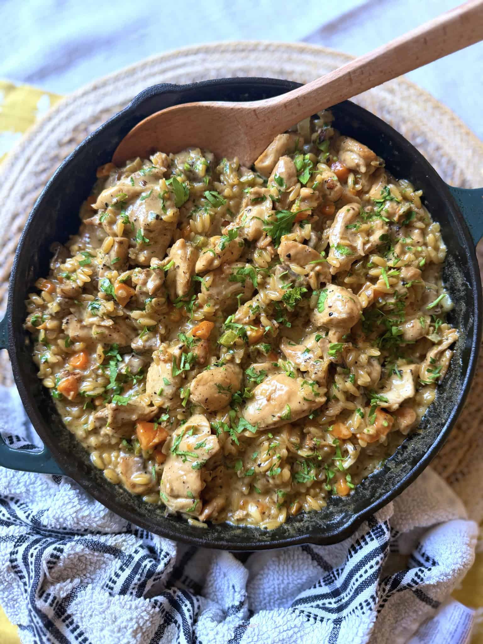 Creamy chicken and mushroom orzo in an iron skillet