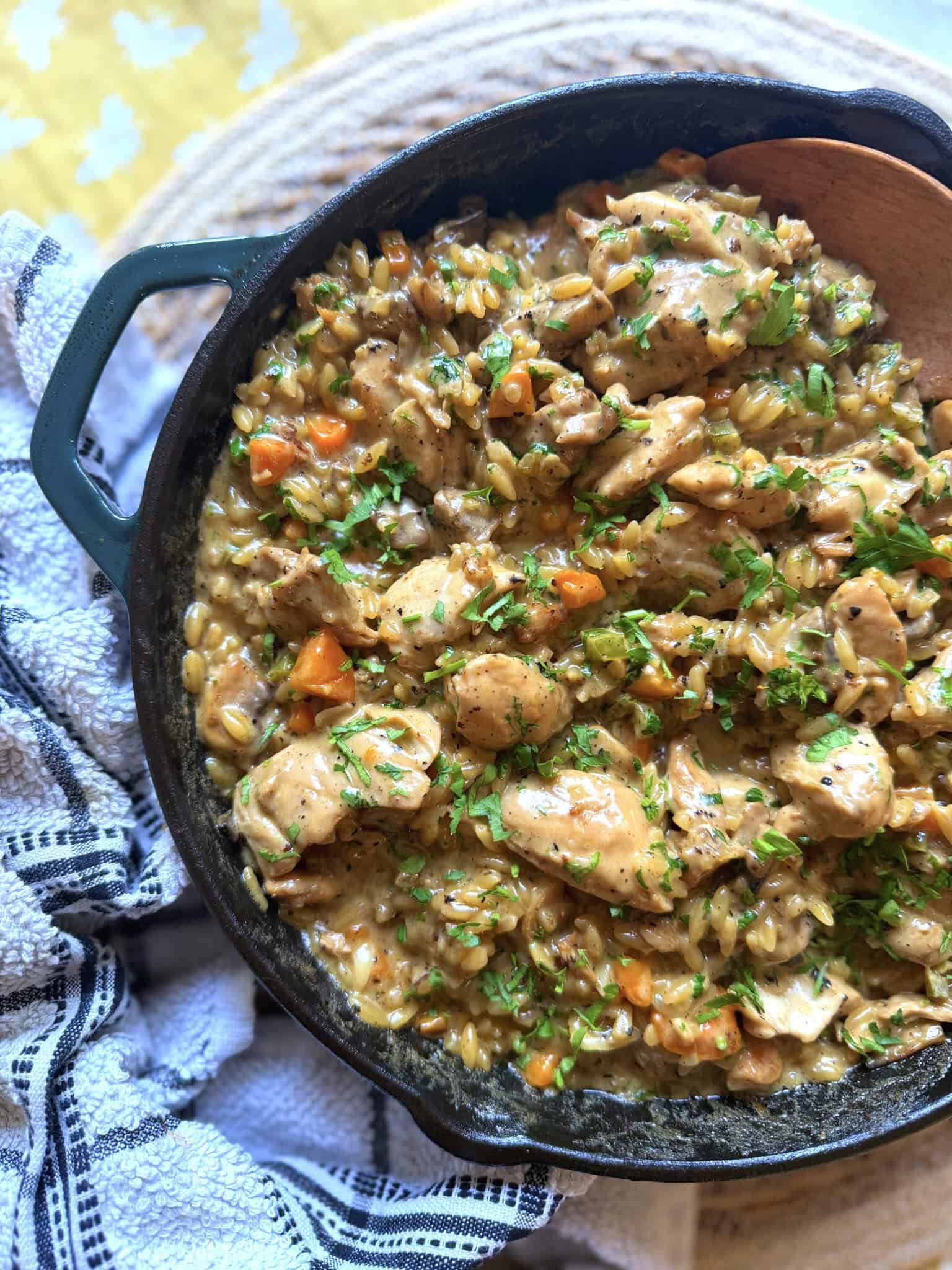 Chicken and mushroom orzo pasta in a iron skillet