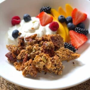 granola with greek yogurt, berries and mango