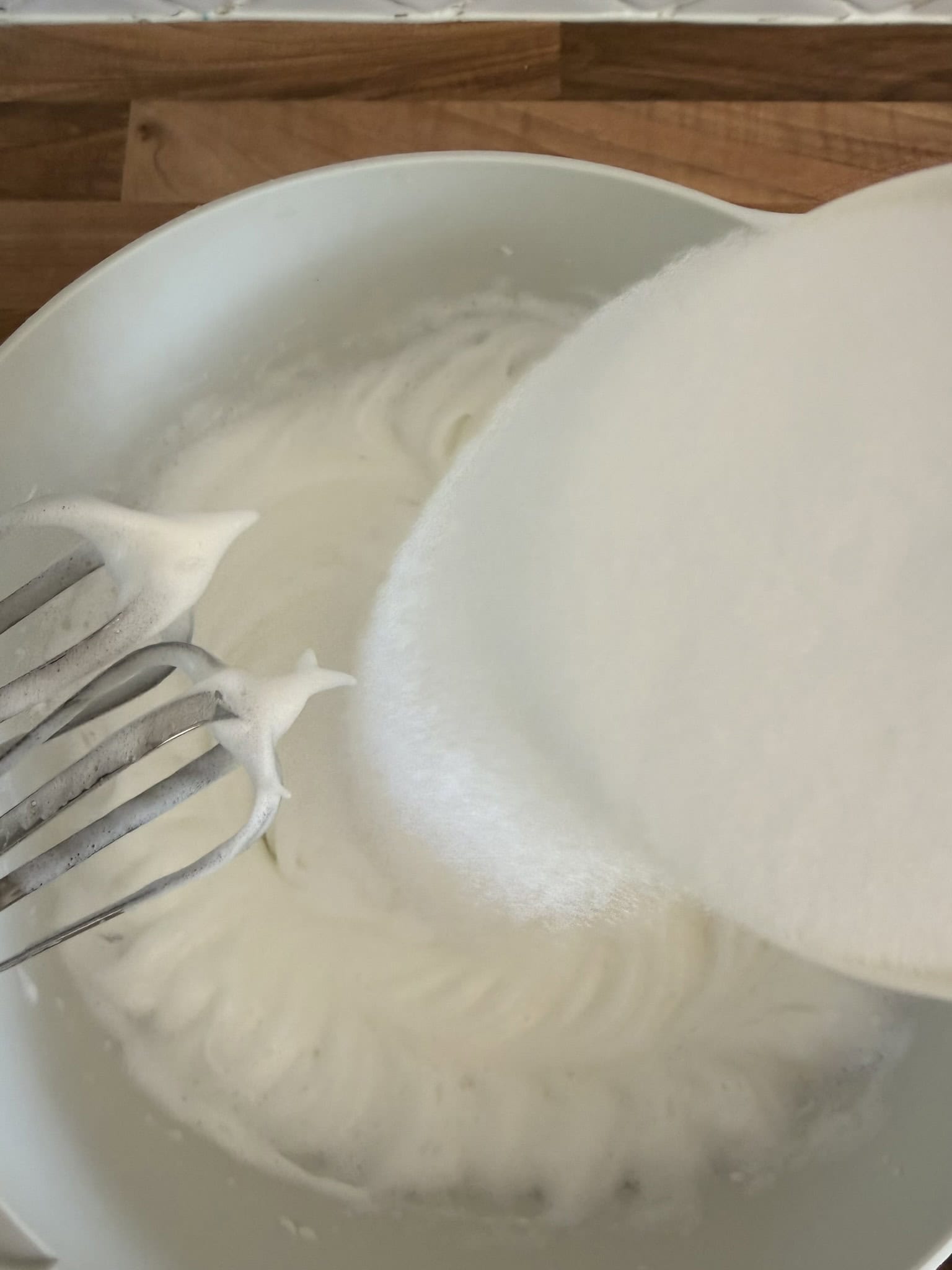 add sugar to egg whites