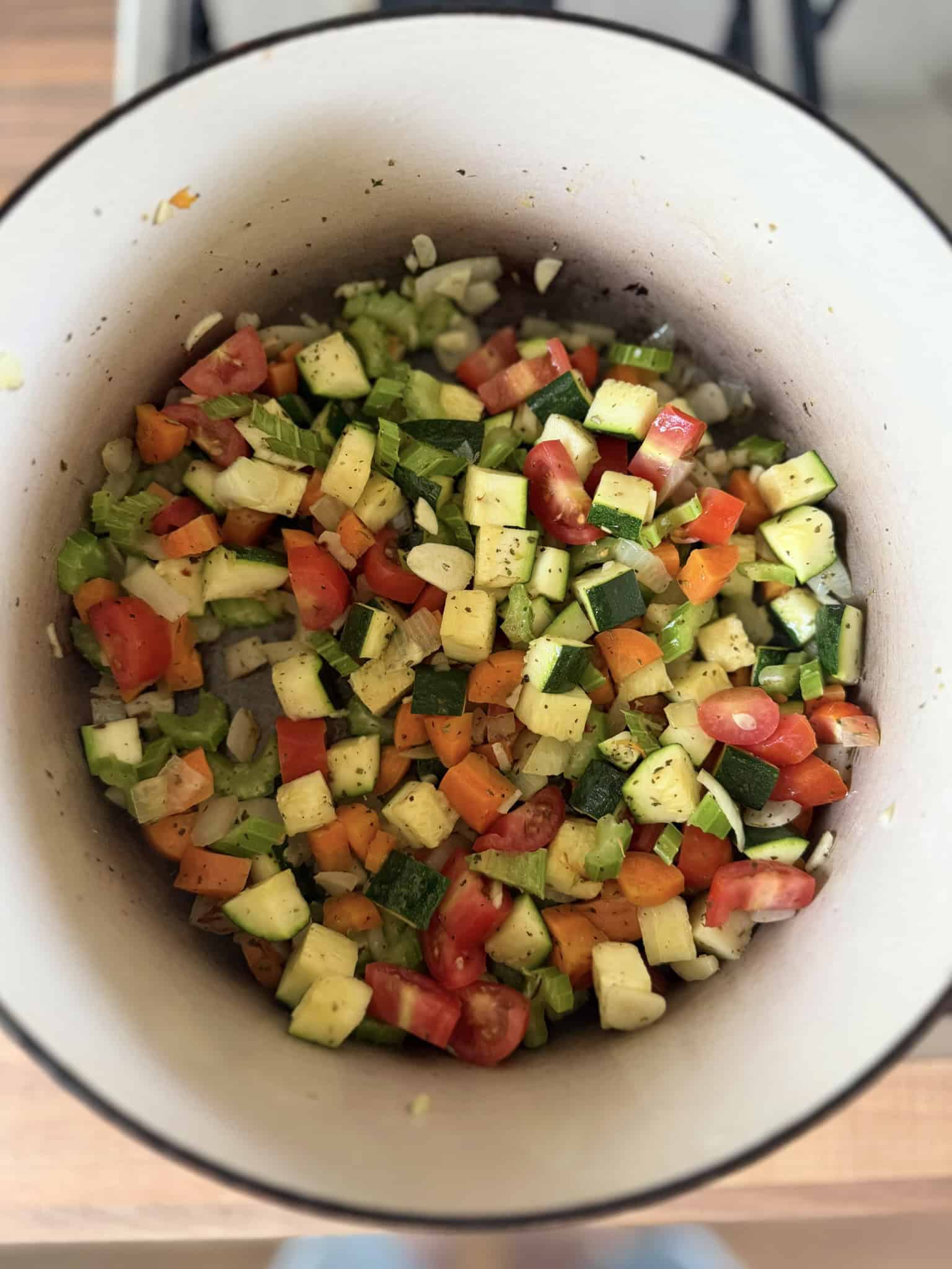 Sautee vegetables in pan