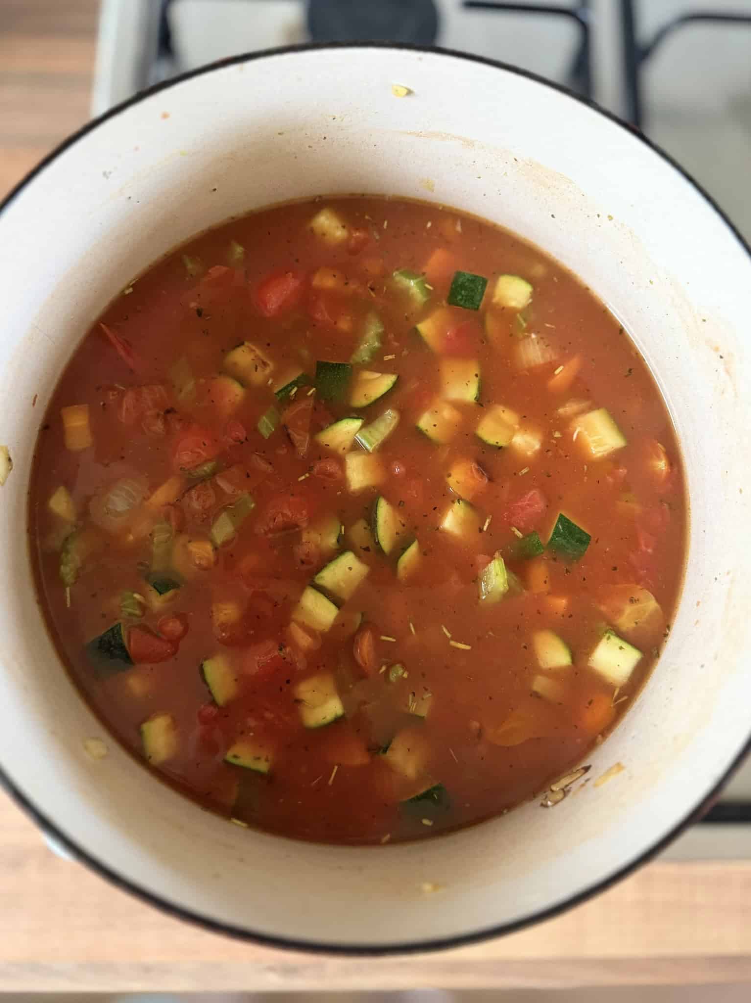 stir in stock and tomatoes