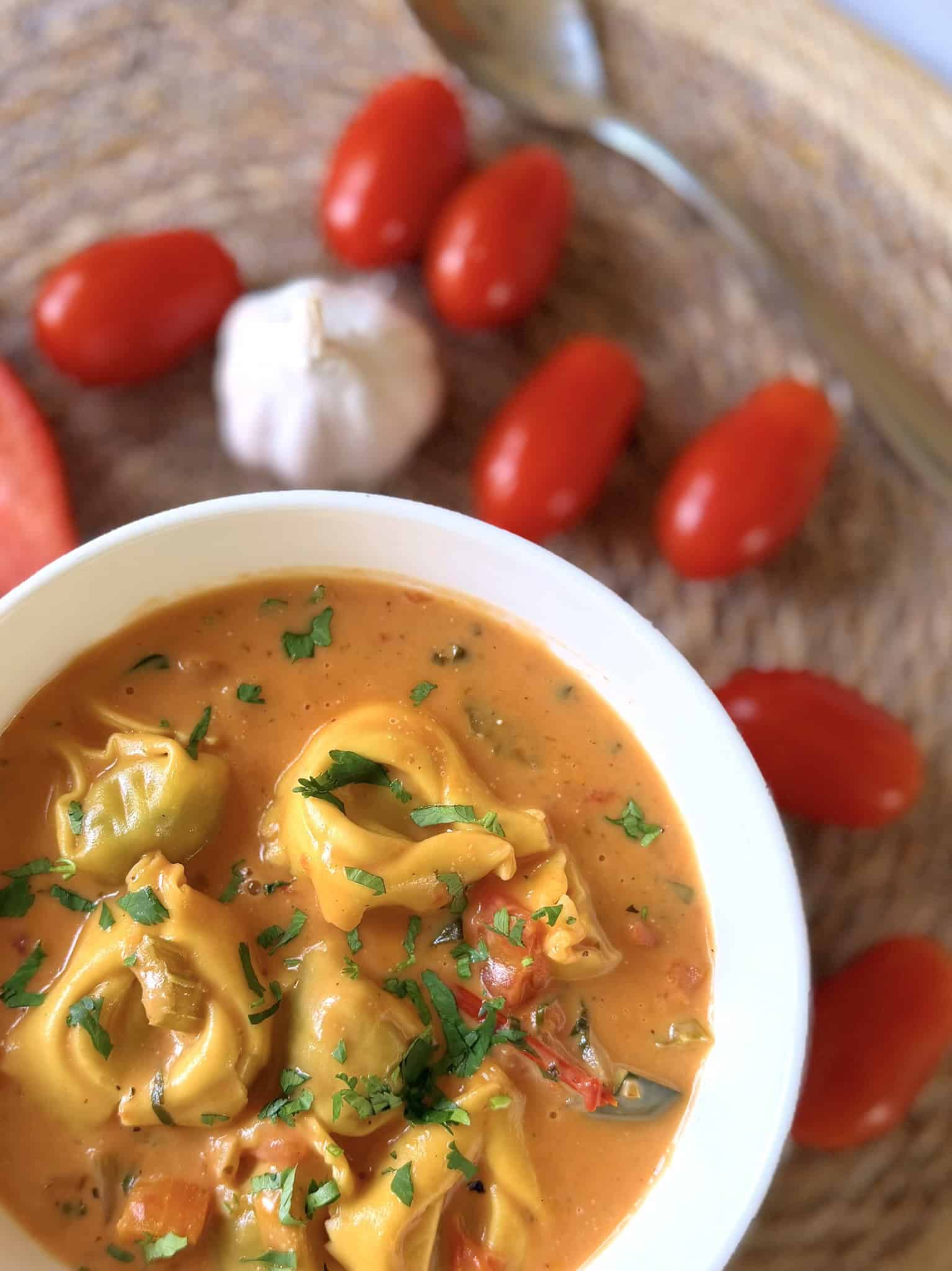 creamy tortellini soup with tomatoes and garlic