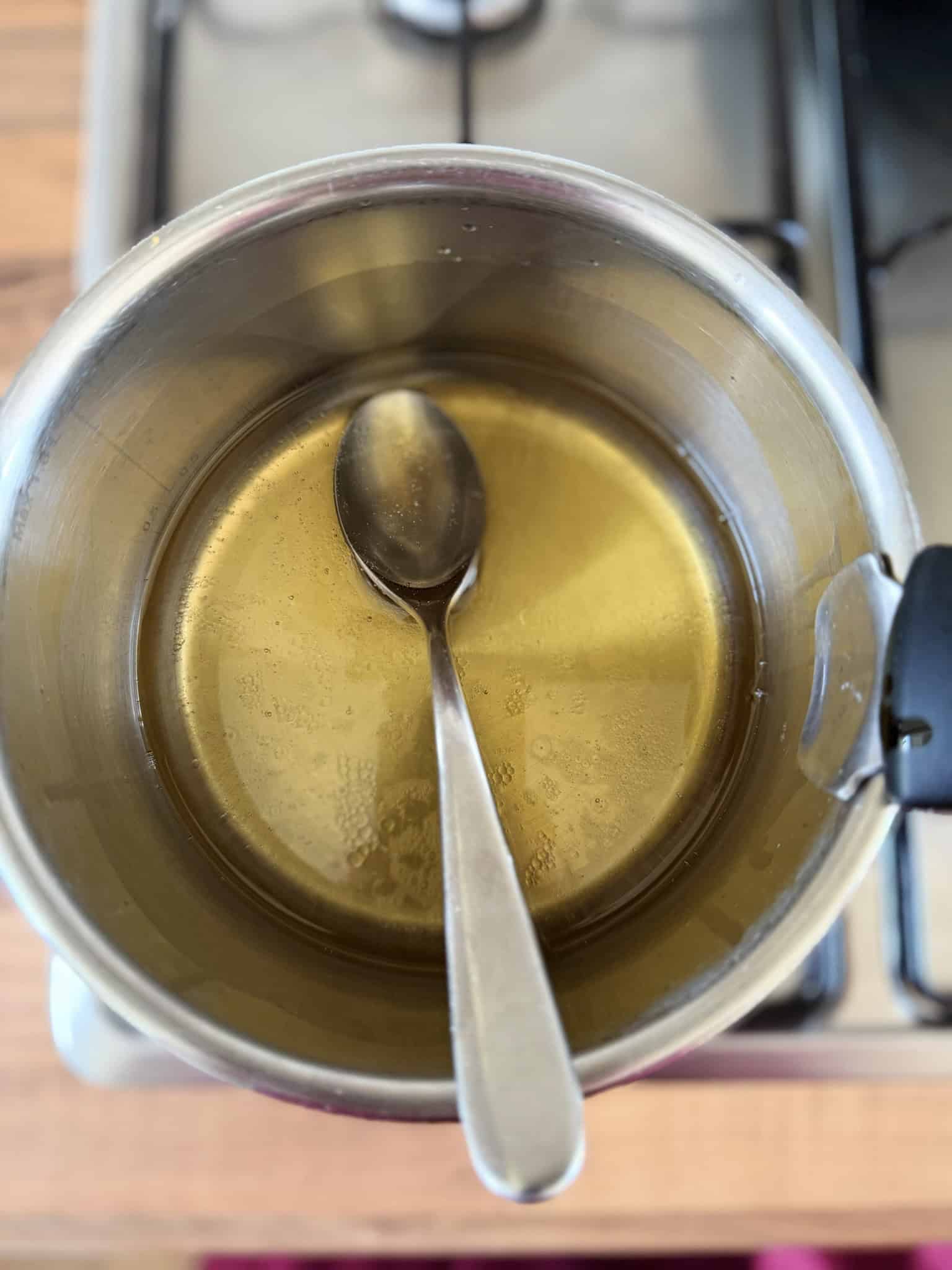 melting coconut oil with honey in a pan
