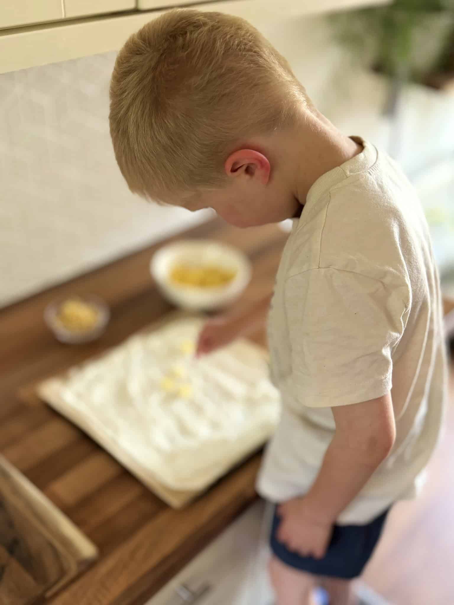 boy decorating yogurt