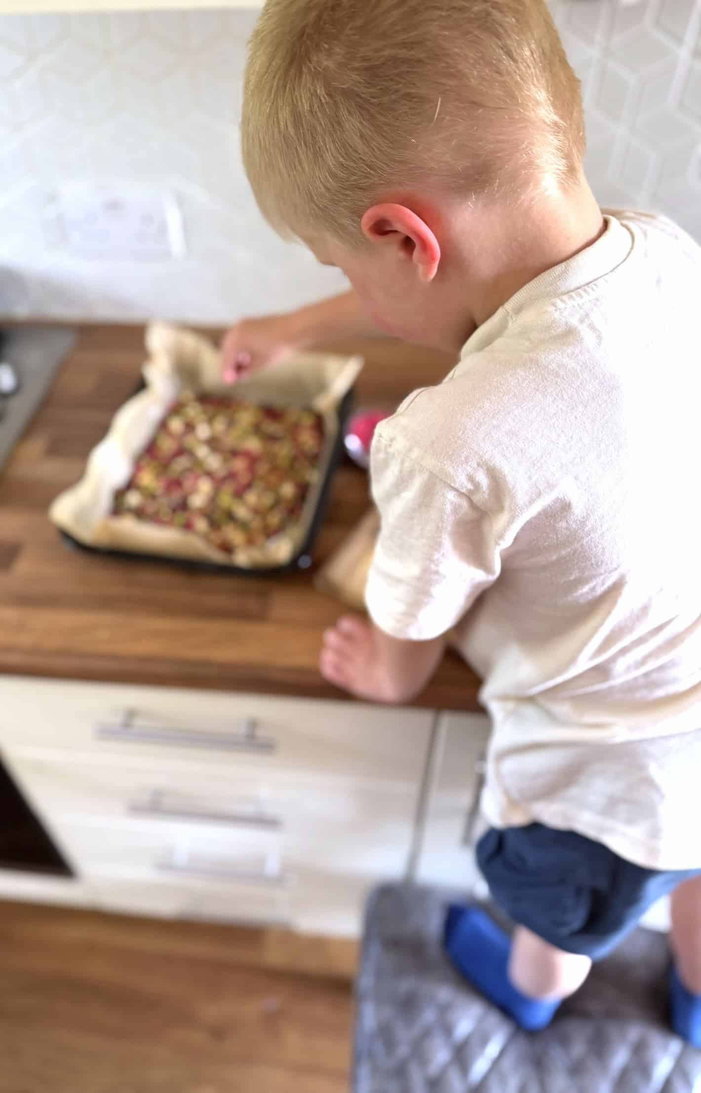 adding toppings to biscuits