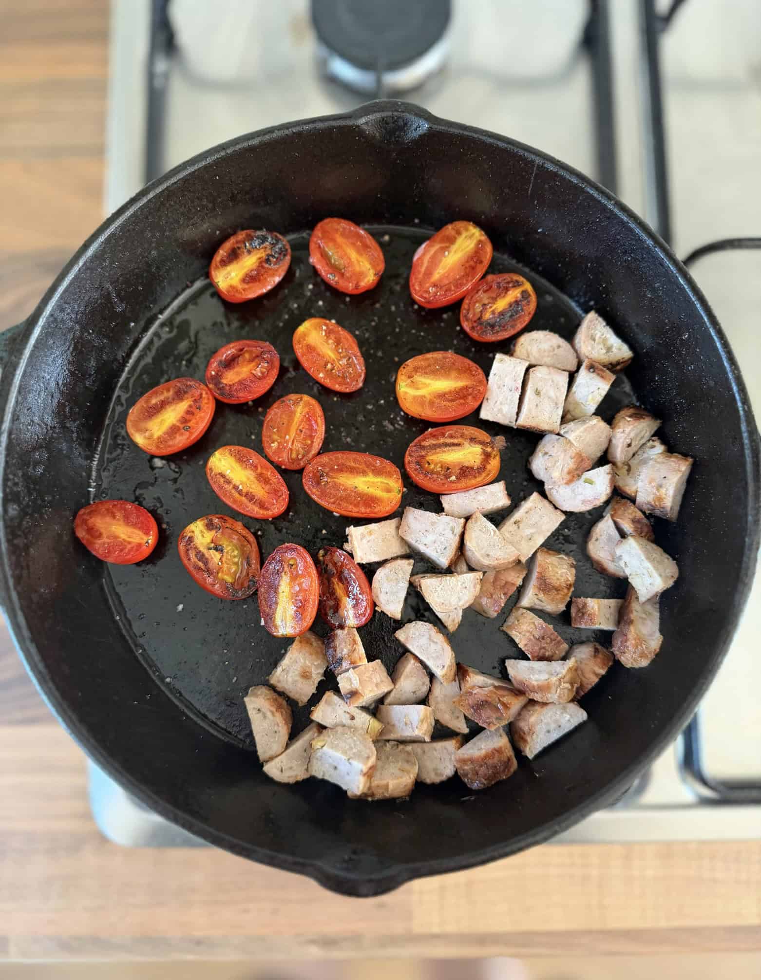 sautee tomatoes and sausage