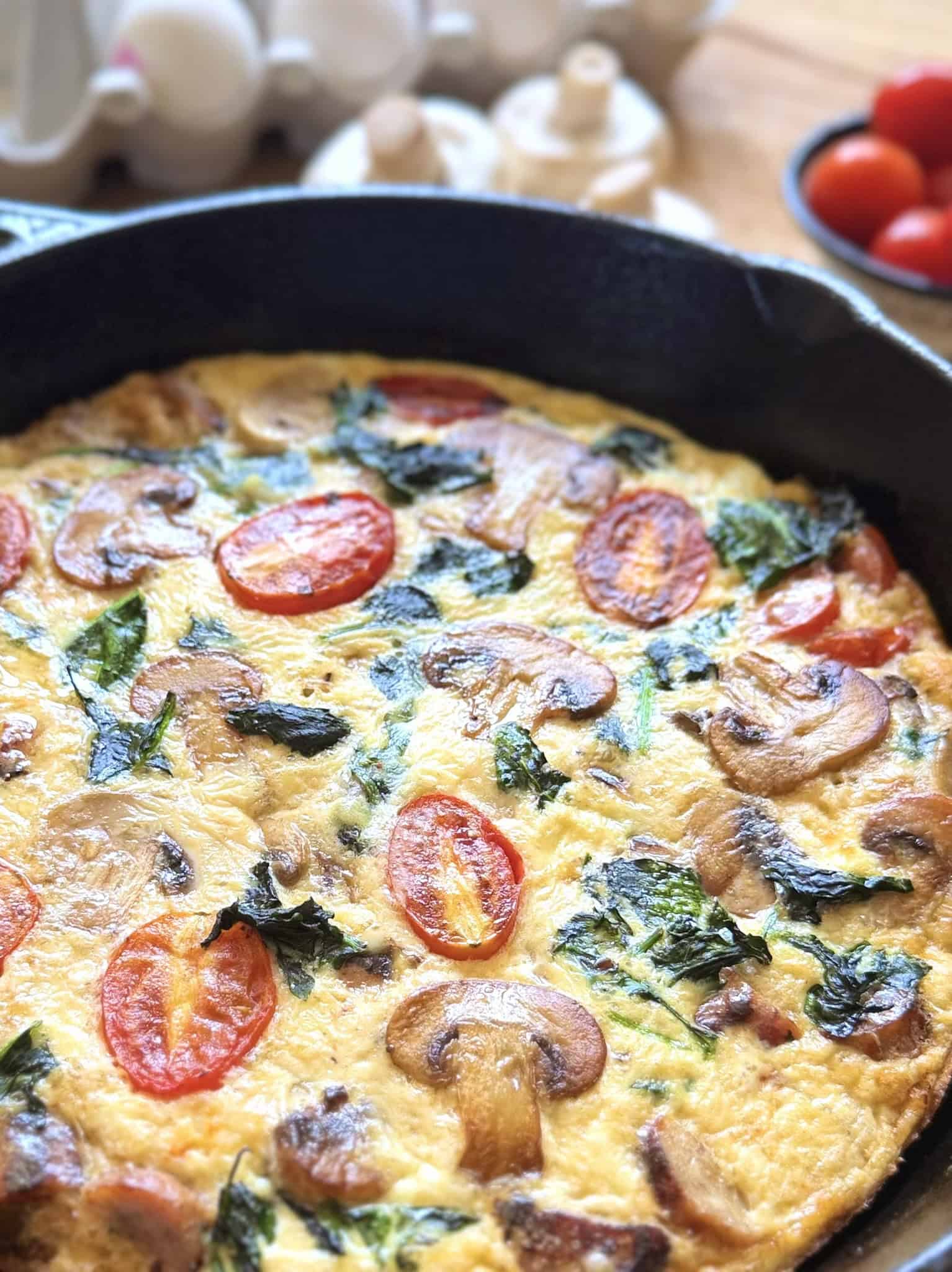 sausage, mushroom, tomato and spinach omelette