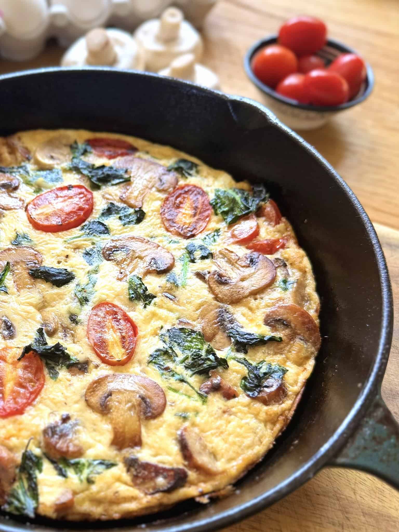 Breakfast sausage frittata in a skillet at an angle
