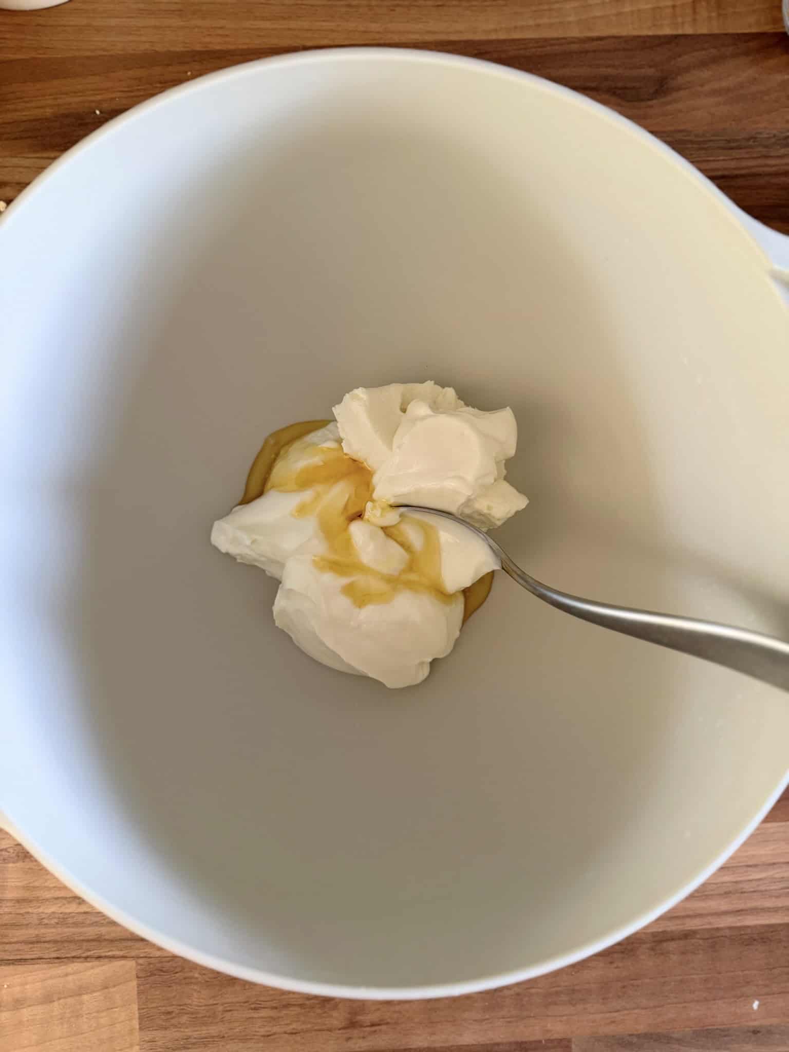 Mixing yogurt and cream cheese