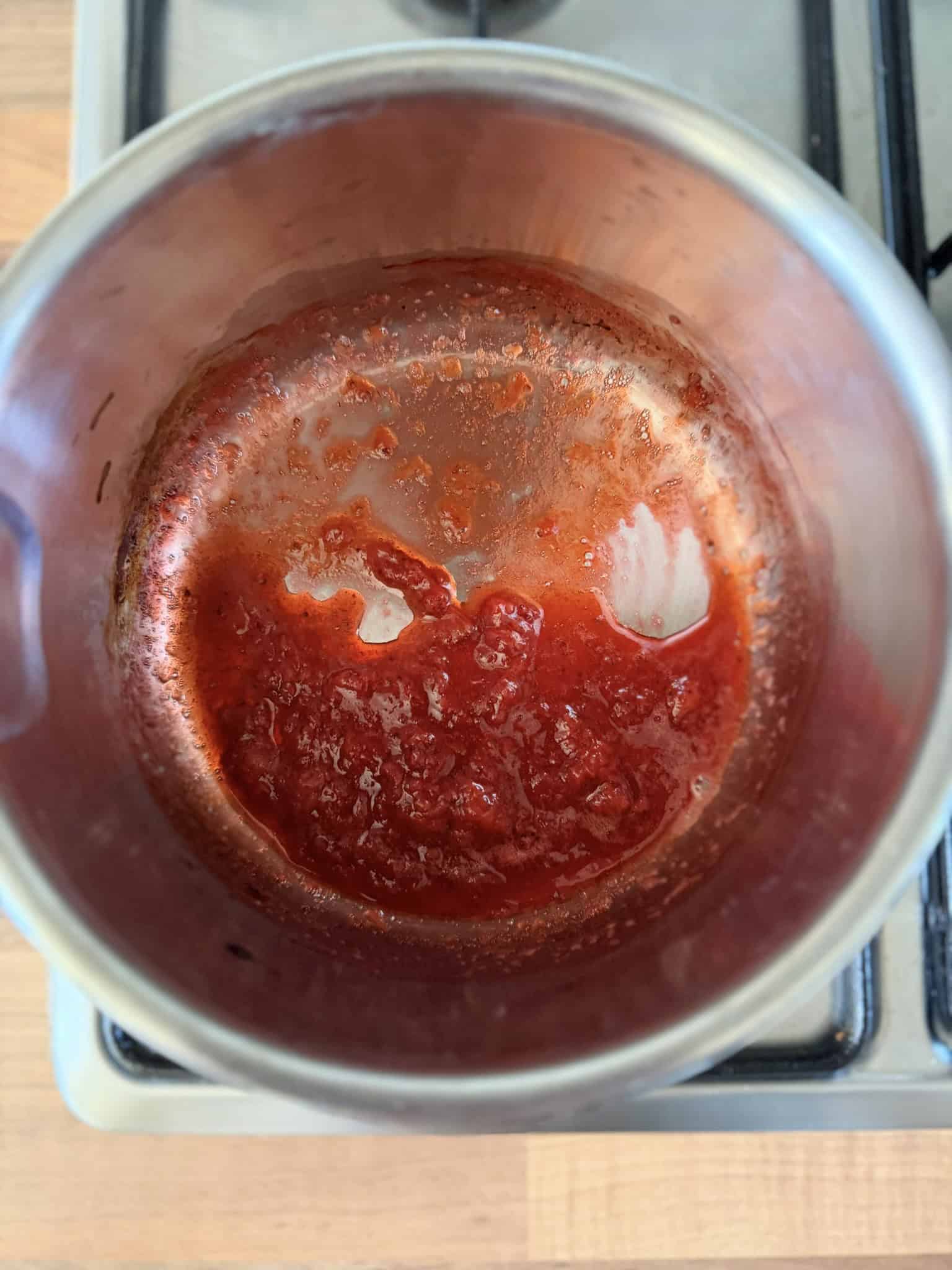 making strawberry cheesecake topping