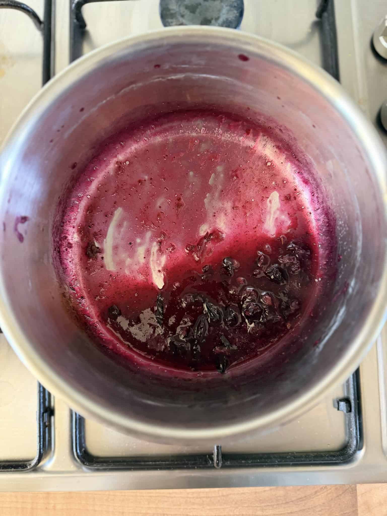making blueberry cheesecake topping