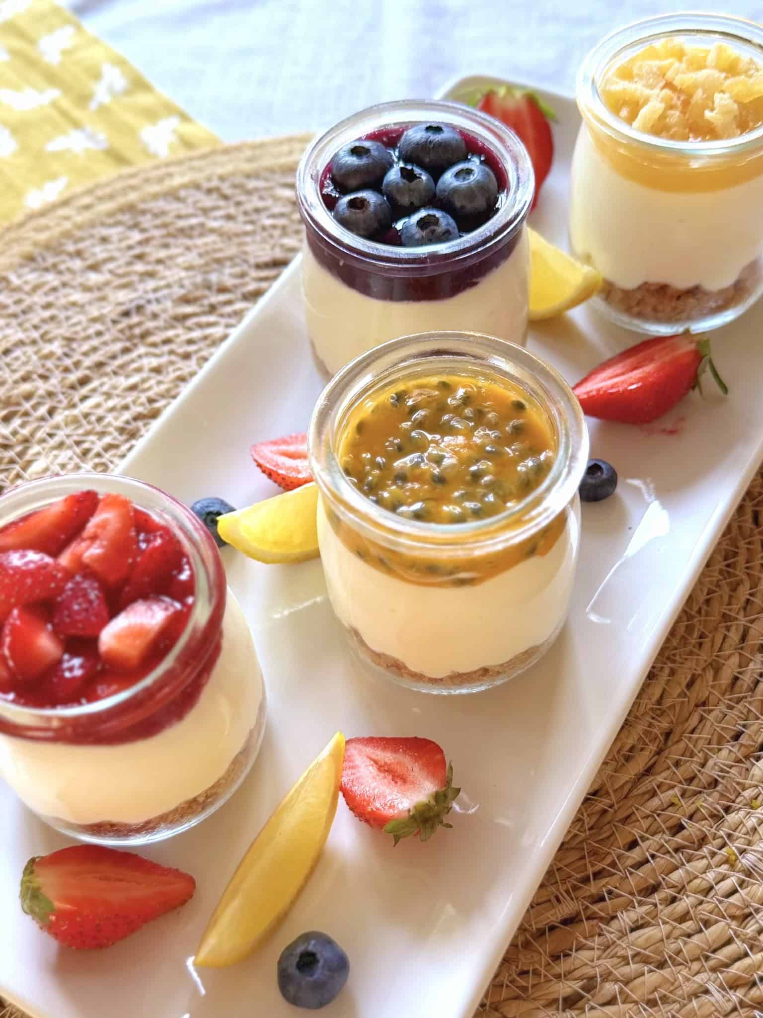 Mini cheesecakes with fresh fruit in mini jars