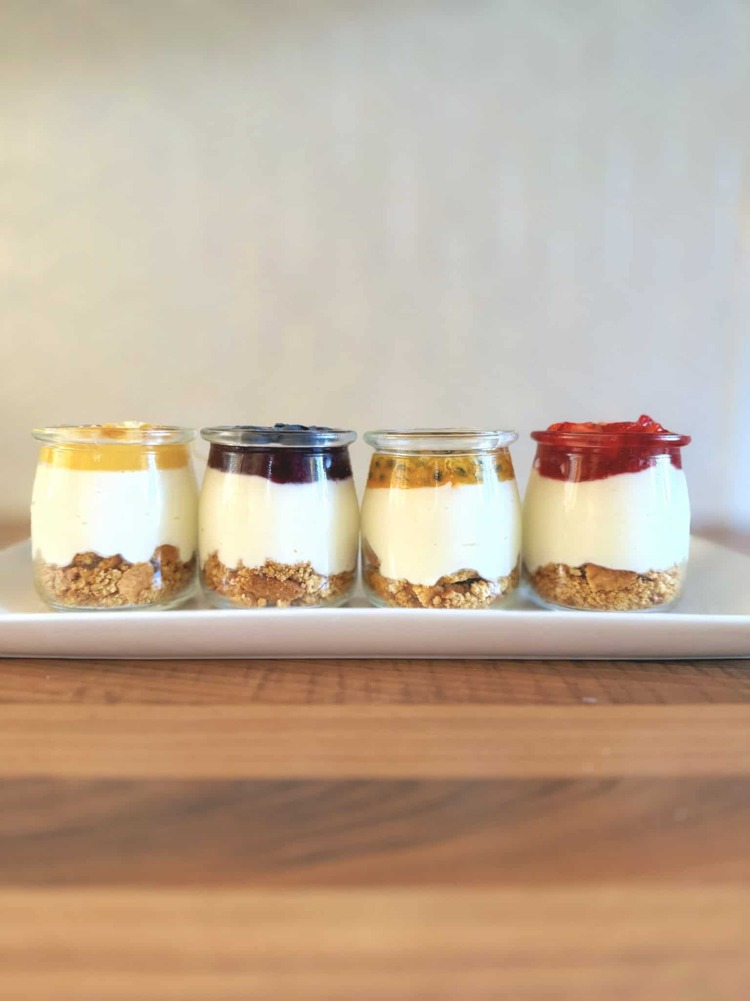 mini cheesecakes in a line