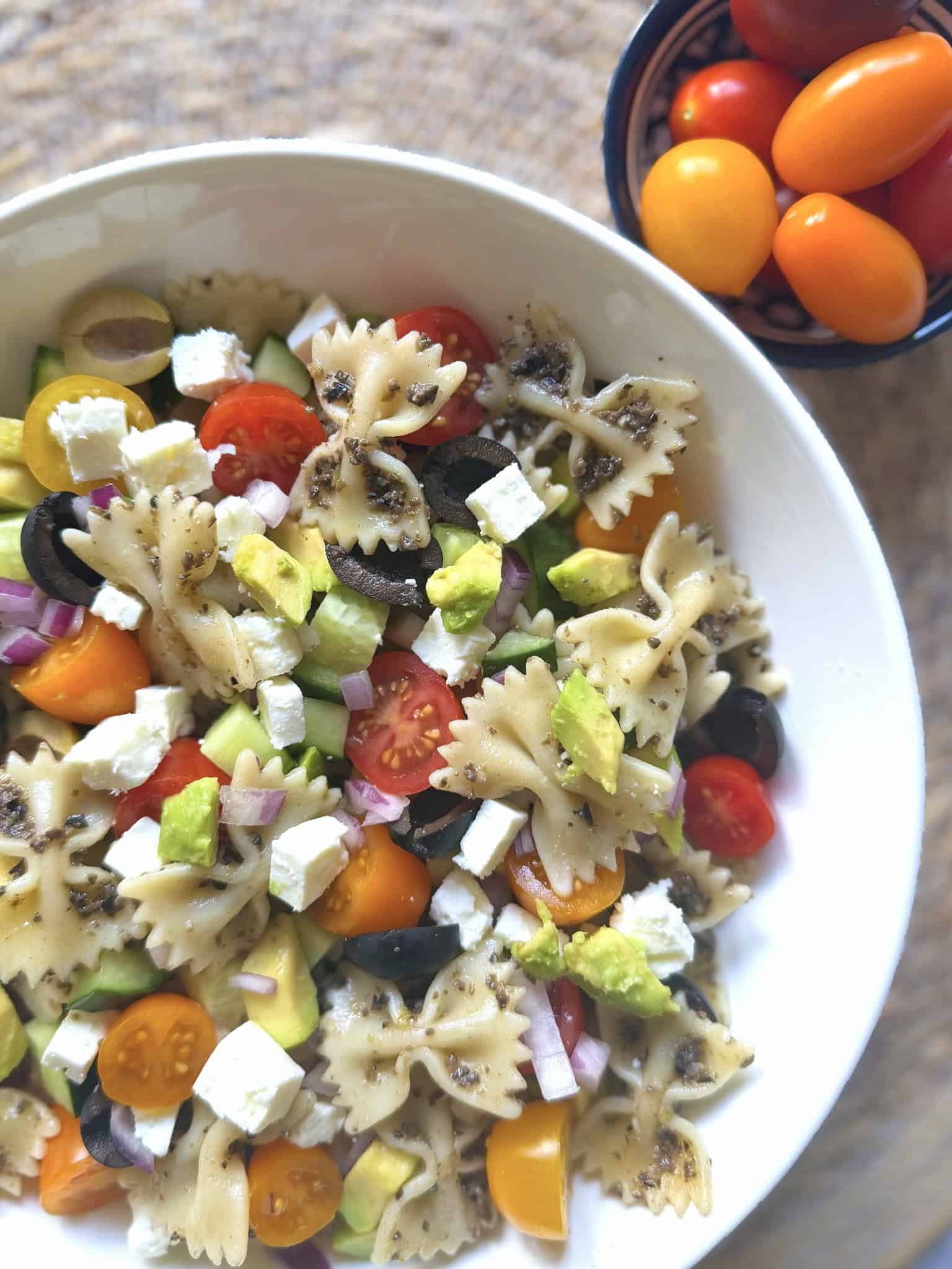 Mediterranean pasta salad in white bowl